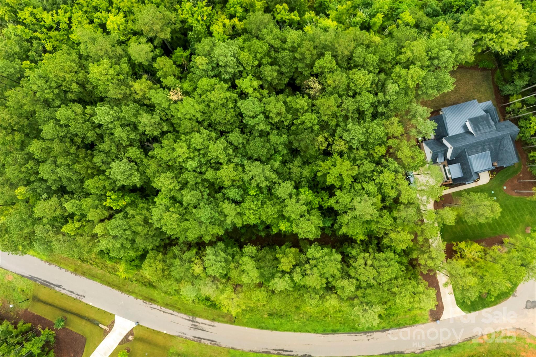 Welcome to 3933 Ostler Ct—an exceptional opportunity to create your custom home on a stunning lot nestled in the heart of the exclusive Riverchase Estates. Tucked away near the rear of this prestigious gated community, this homesite offers unmatched privacy, backing to protected wooded common area that eventually leads to the scenic Catawba River.

This lot gives you the flexibility to build exactly what you envision. There is no required timeline to build and you’re welcome to bring your own builder—or stop by the Simonini Homes office for custom design options.

Riverchase Estates offers resort-style living with 2,000+ acres of preserved woodlands, a 6,000 sq ft clubhouse, fitness center, tennis courts, amphitheater, playground, nature trails, and a showstopping outdoor pool. Enjoy canoeing, kayaking, and the peace of mind that comes with low SC taxes and a short drive to Charlotte. You're also just minutes from shopping and dining.