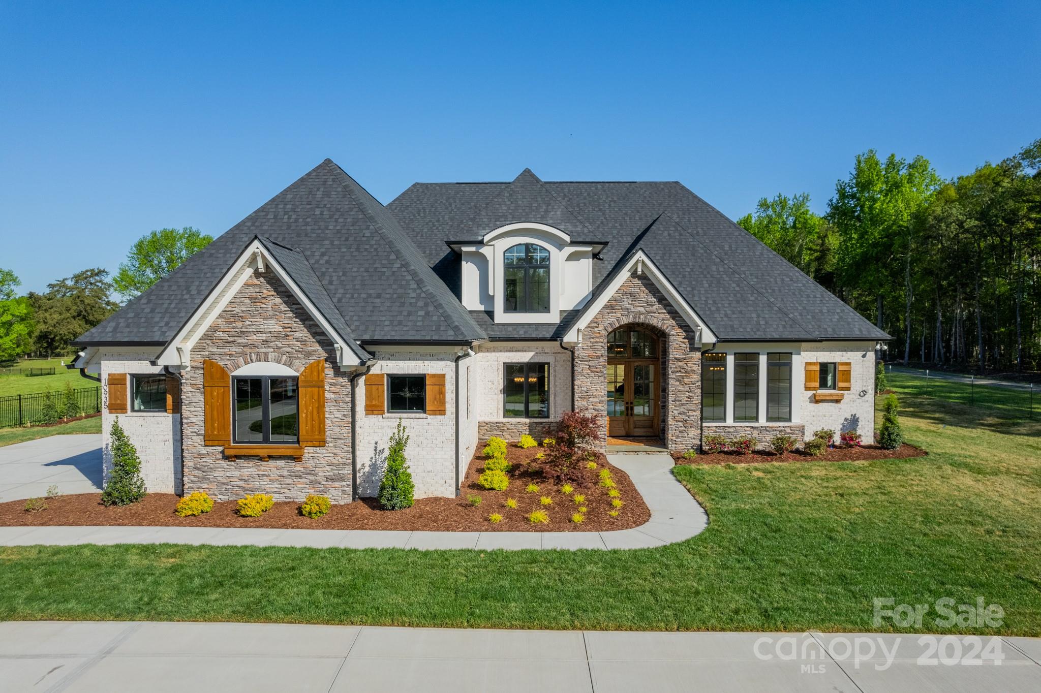 Another LINNANE HOMES STUNNER! NEW INVENTORY HOME! 1 MONTH FROM COMPLETION! ONLY A 5 MINUTE DRIVE TO BALLANTYNE!! Breathtaking Windsor Plan on premium 1.36 Acre estate lot in sought after Ballantyne area! Gorgeous wide open floor plan w/3 beds on the Main including a large Primary Suite, oversized light filled Kitchen w/huge island & beautiful finishes throughout! 2nd floor w/Huge bonus, Bed & Full Bath, Media rm & large walk-in storge! 4 Bedrooms, 3.5 baths total. Covered back porch w/outdoor fireplace, built in porch heaters & remote controled power screen! Sub-Zero refrigerator, Thermador Professional Series double ovens & 6 burner cook-top. Lots of extra built-in cabinets. ENERGY STAR CERTIFIED HOME (40 to 50%) More Energy efficient, 3 Car garage, tankless water heater. Professional landscaping including 40 to 45 (6 to 8) ft evergreen trees to be installed before closing. Ideal LOCATION!! Perfect setting for a pool & outdoor living. Completion FEB 2024!! EXPECTING MULTIPLE OFFERS!