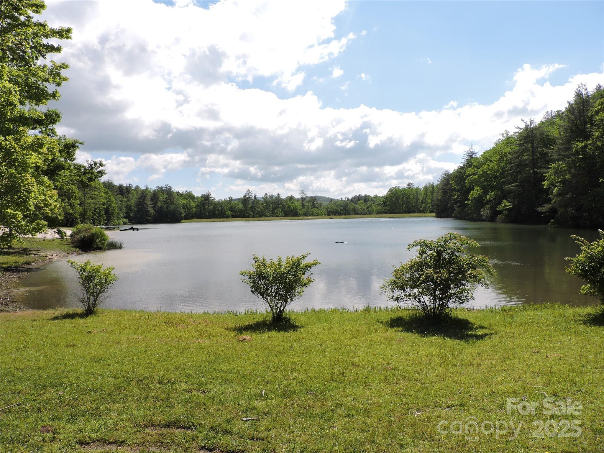 REDUCED! MOTIVATED SELLER!
1 acre lot directly across from Swiss Pine Lake, with bold creek running through the property. Peaceful views, access to lake amenities (Beach, Picnic area, trails). Engineered septic system is needed! ideal for custom home or eco- conscious build. Minutes from downtown Spruce Pine, Near Boone & the Blue Ridge Parkway. Soil study is available.