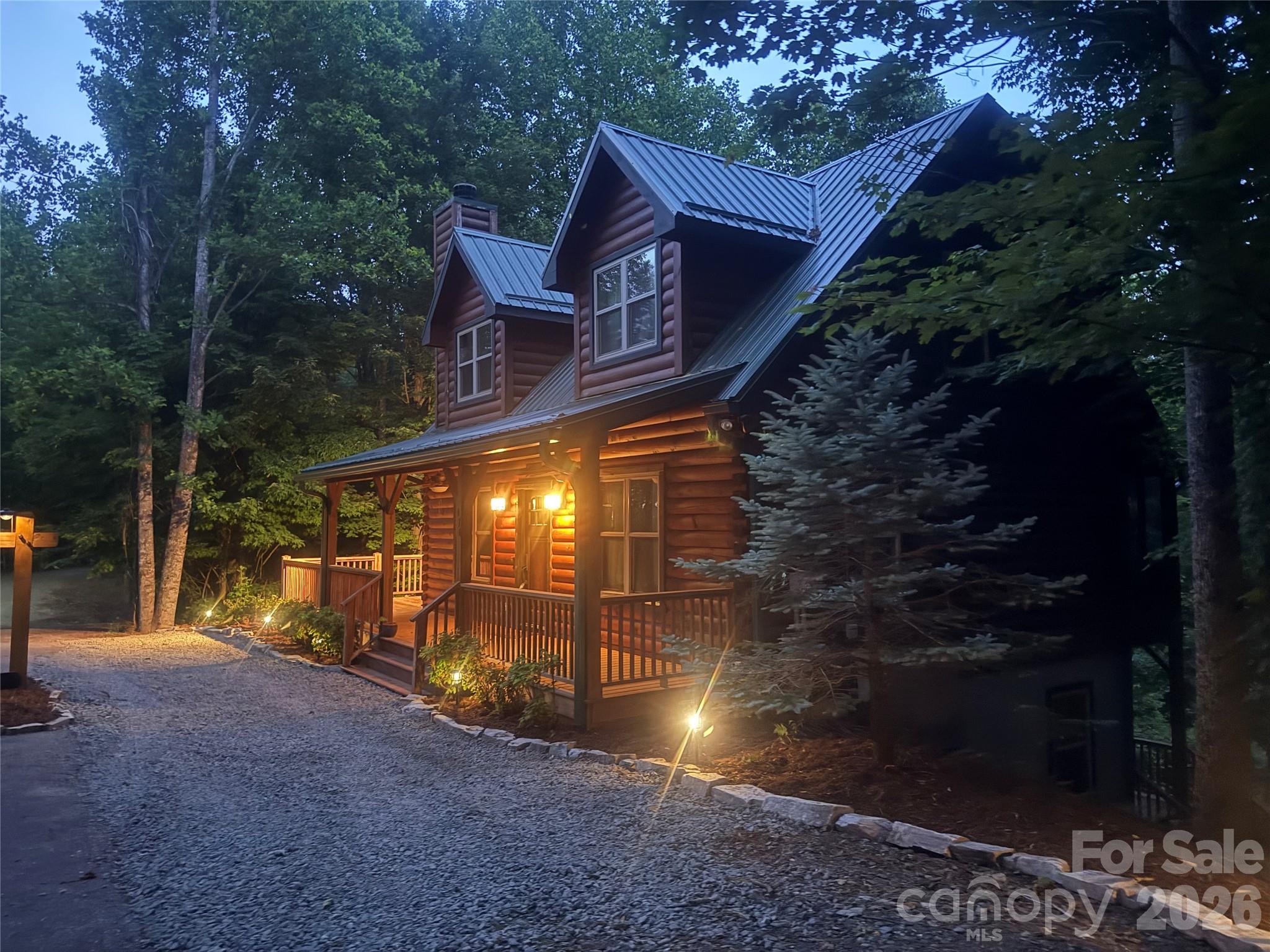 Welcome to your private mountain retreat at “Bearstone Ridge Cabin,” where breathtaking seasonal mountain views, timeless craftsmanship, and peaceful living come together.

This stunning three-level log cabin offers 3 bedrooms and 3 full baths, with a private bedroom suite on each level—perfect for hosting guests, multi-generational living, or maximizing short-term rental potential.

Inside, you’ll find warm, inviting interiors featuring tongue-and-groove wood walls, rich wood flooring, and a beautiful blend of rustic charm and modern comfort. The heart of the home is the floor-to-ceiling stone wood-burning fireplace, creating a cozy focal point for gathering on cool mountain evenings.

The open-concept main level flows into a well-appointed kitchen with granite countertops and quality finishes, while bathrooms also feature granite surfaces and tile flooring for a polished, cohesive look.

One of the home’s most striking features is the dramatic triangular window in the loft, flooding the space with natural light and perfectly framing the surrounding woods and seasonal mountain views—bringing the outdoors in year-round.

The fully finished basement provides additional living and entertaining space, complete with access to its own private deck—ideal for guests or a separate retreat area.

For those considering short-term rental potential, the home offers flexible sleeping arrangements that can comfortably accommodate up to 12 guests, with a sleeper sofa in the basement and a futon in the loft adding additional space for visitors.

Outdoor living is just as impressive, with:
• A large wraparound deck perfect for entertaining or relaxing
• A screened-in porch for enjoying the fresh mountain air without interruption
• A lower-level deck offering even more space to unwind

Set within a log cabin community, residents enjoy access to:
• A scenic lake for kayaking and fishing
• A refreshing community pool and hot tub
• A welcoming changing room, bathhouse, and cabana
• A peaceful, nature-filled setting

A rare bonus—all furniture, décor, furnishings, and household accessories currently in the cabin are included with an acceptable offer, allowing the new owner to begin enjoying the property immediately or continue operating it as a vacation rental from day one. Beautifully furnished and thoughtfully appointed throughout, this home is truly turnkey and represents exceptional value for a primary residence, mountain getaway, or income-producing investment property.

Conveniently located within easy driving distance of Charlotte, Asheville, and Hickory, you’ll enjoy the perfect balance of seclusion and accessibility.

Come experience mountain living at its finest—schedule your private showing today.

Listing agent is a friend and neighbor of the sellers.