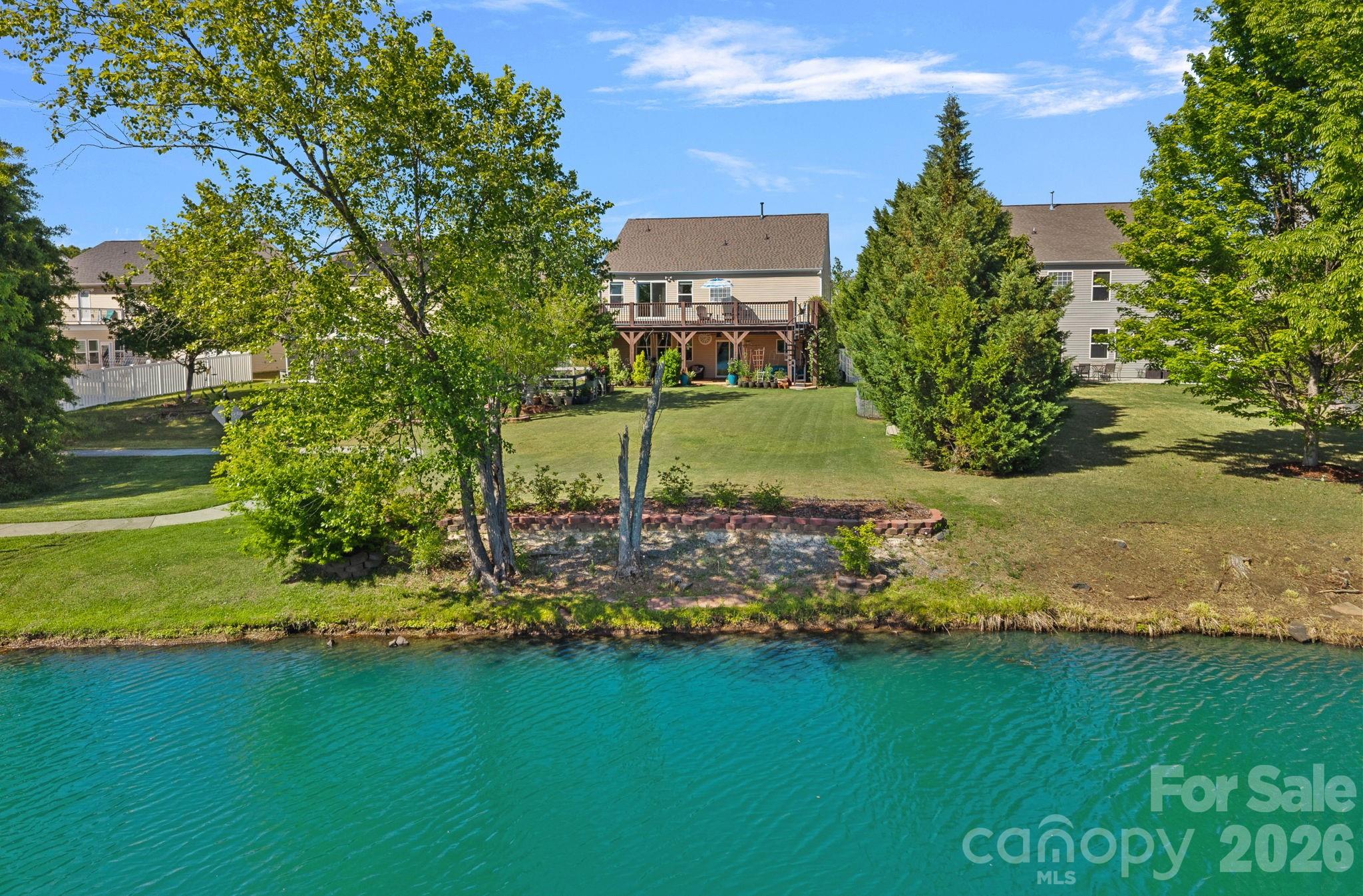 Rare opportunity in Stone Creek Ranch! This spacious home features a private balcony with beautiful water views!

Experience elevated living in the highly desirable Ballantyne area within the sought-after Stone Creek Ranch community. This northeast-facing, 6-bedroom, 3-bathroom home is perfectly positioned on a private lot that overlooks the water, offering a scenic backdrop with peaceful pond views. 

Designed for comfort and functionality, the main floor features an open layout with a spacious kitchen offering abundant storage and counter space,  opening to a family room with a gas fireplace and exceptional water views. The main level also includes a bedroom, full bathroom, formal sitting room, a pantry, and a mudroom. Beyond the sliding doors is an expansive backyard and peaceful pondside walking path to enjoy.

Upstairs, the spacious primary suite creates a private retreat where you can enjoy a morning coffee with a scenic pond view or relax in the evenings taking in the quiet water views from your private balcony. From the balcony, a spiral staircase leads directly to the extended patio below for a seamless indoor-outdoor experience. The primary bath has dual vanities, a soaking tub, separate shower, and walk-in closet. The second floor also includes a marble-floor flex space perfect for a relaxation/meditation room, four additional bedrooms (including one oversized bonus/recreation room), and multiple walk-in closets. This home has exceptional storage solutions on each floor. 

Notable upgrades include a brand-new roof (2023), two high-efficiency HVAC systems (2023), a garage fully equipped for 2-car simultaneous charging (one Level 2 charger and one Level 2 outlet with dedicated wiring for a second), an app-controlled 9-zone irrigation system, smart garage door opener with an integrated camera, a Vivint security system, and an enclosed, raised-bed vegetable garden.

Stone Creek Ranch residents enjoy access to premier amenity centers, including north and south clubhouses, pools, playgrounds, and walking trails. Located just minutes from I-485, Life Time Fitness, Flat Branch Nature Preserve, and top-tier shopping and dining at Stonecrest, Rea Farms, Waverly, The Fountains, Promenade on Providence, and Blakeney Town Center. Located near top-rated schools, with the new Cato Ridge Middle School opening soon. This home offers incredible space and beautiful water views!
