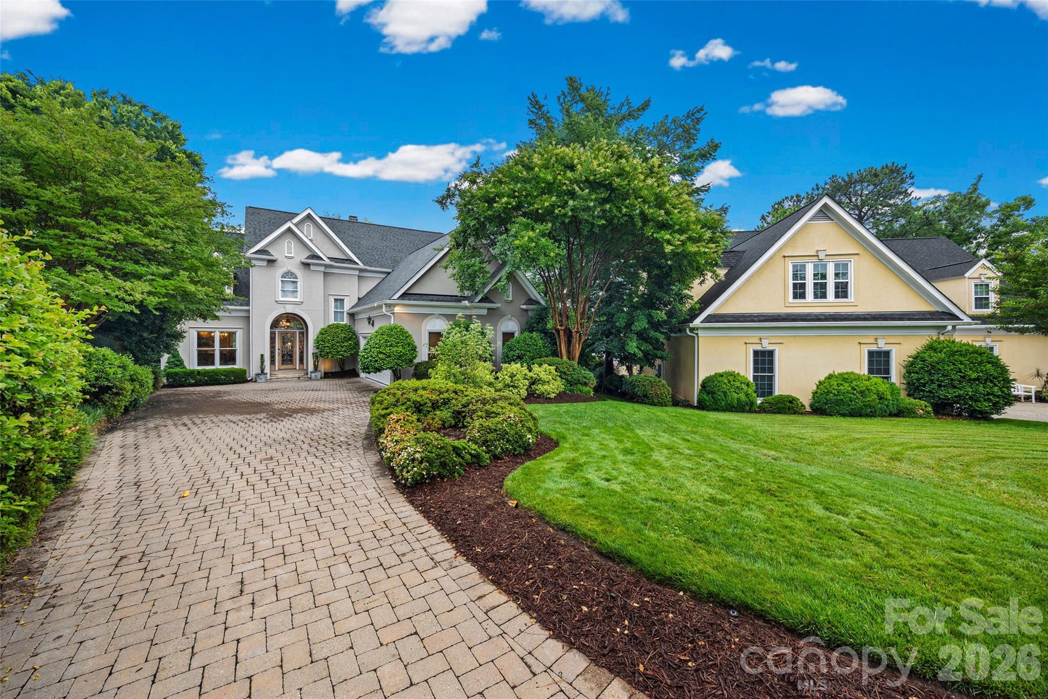 Lakefront living, convenient to all Charlotte and Lake Wylie have to offer and elegance and personality galore!  Sweeping water views greet you when you enter the front door with floor to ceiling windows and huge sunroom to capture the lake and bring it inside!  Amazing landscaped yard and outdoor living with decks, dock with eat in area and lift for your boat.  This home is located across from McDowell park /green space and not looking in your neighbors home.  Riverpointe neighborhood offers a pool, clubhouse, sandy beach and kayak launch area, playgrounds, docks  and walking trails.  The first floor offers the primary suite with more windows and light, soaking tub w/ walk in shower, formal dining room, eat in, laundry, kitchen, happy sunroom and the great room.  The second floor offers 3 bedrooms, 2 full baths ensuite AND bonus room with built in for all your books, office area tons of storage. The garage is oversized 2 car garage with storage room and deep.  NEW ROOF in April.  Newer HVACs and walk in crawl space to store all your unused water toys or gardening supplies.  This waterfront home is the package and waiting for next owner to enjoy life at the lake.  This home is 1 owner so all your questions will get answered.   This magnificent house is past the pool on the peninsula at the end of Riverpointe Drive.  WELCOME HOME!!