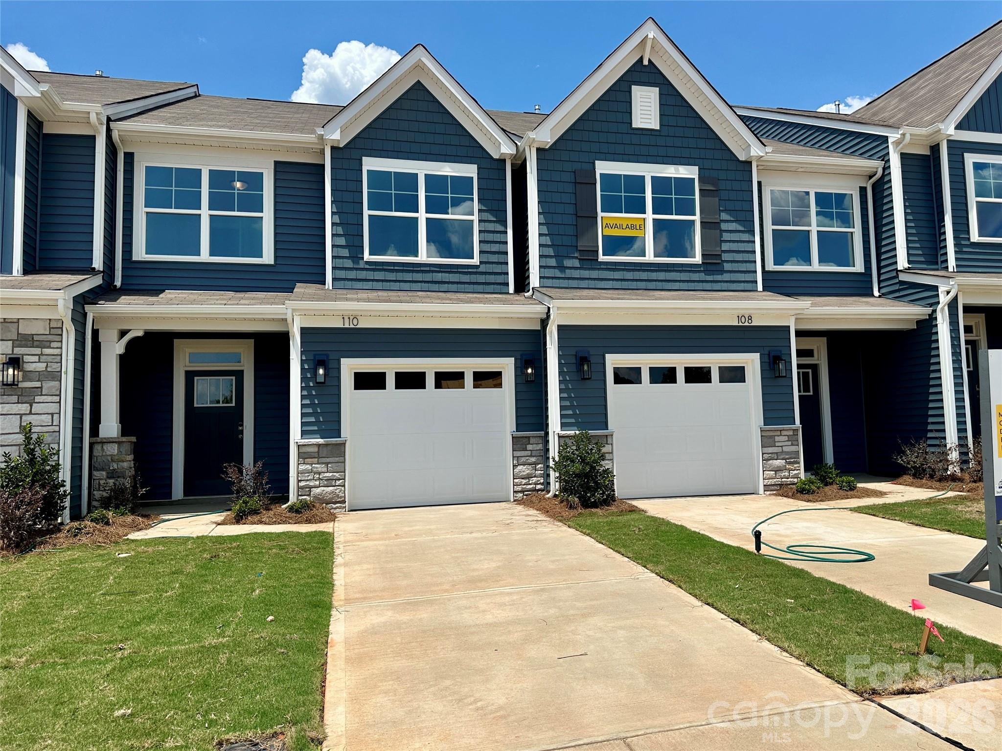 Welcome to the brand-new Norman Creek community in Troutman! This Ashland plan has 3 bedrooms, 2.5 baths, and more than 1,800 square feet of living space. Enter the home through the foyer with tray ceiling and a convenient, beadboard drop zone to see the open kitchen, dining area and family room that walks out to a 10x8 patio. The kitchen features gray, Shaker-style cabinets with matte black hardware, quartz countertops, a spacious island, tile backsplash, and stainless appliances, including a gas range and microwave. The open main floor has beautiful and durable Enhanced Vinyl Plank (EVP) flooring throughout. The upper floor features a loft, all 3 bedrooms, 2 full baths and laundry room. The primary bath has a tiled shower, dual-sink vanity, and linen closet. The upstairs full bath has a tub/shower combo. All baths have gray cabinetry and quartz counters. Enjoy easy access to interstates, shopping, dining & recreation. Additional features include a half bath on the main level, upgraded trim package and smart home package. Community amenities include an outdoor pool and cabana. Find out more today and come visit this beautiful community!