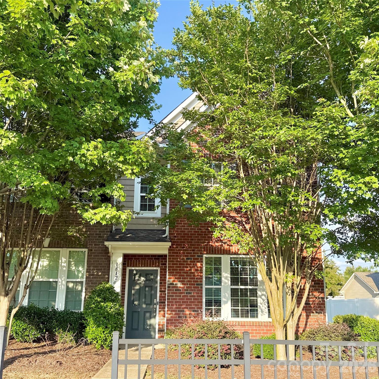 Step right into the comfort of this beautiful three-bedroom townhome that is completely move-in ready and waiting for you in the wonderful Harborside community! You will instantly feel at ease surrounded by fresh paint and the comforting feel of brand new LVP flooring running throughout the entire house. Step out back to your fenced-in private patio, now featuring easy-care artificial turf a perfect spot for morning coffee or evening gatherings. Even the little details are covered, from the updated light fixtures to the impressive detached garage with its shiny black epoxy floor and a new sidewalk. You'll love having access to the community pool for some summer fun! Location is everything! You'll love the quick commute with I-77 nearby and the convenience of being only moments away from the popular shops and restaurants at Birkdale Village. Don't miss the chance to experience this exceptional lifestyle firsthand. Schedule your showing today!