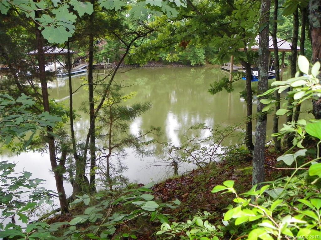This lot is right in the middle of Lake Wylie! You will experience all that Lake Wylie has to offer with shopping, dining and lake life. The neighborhood also has a community pool and clubhouse. This spot is ready to build your home and dock. If you are ready to enjoy swimming, boating, fishing and water sports call today for a private showing.