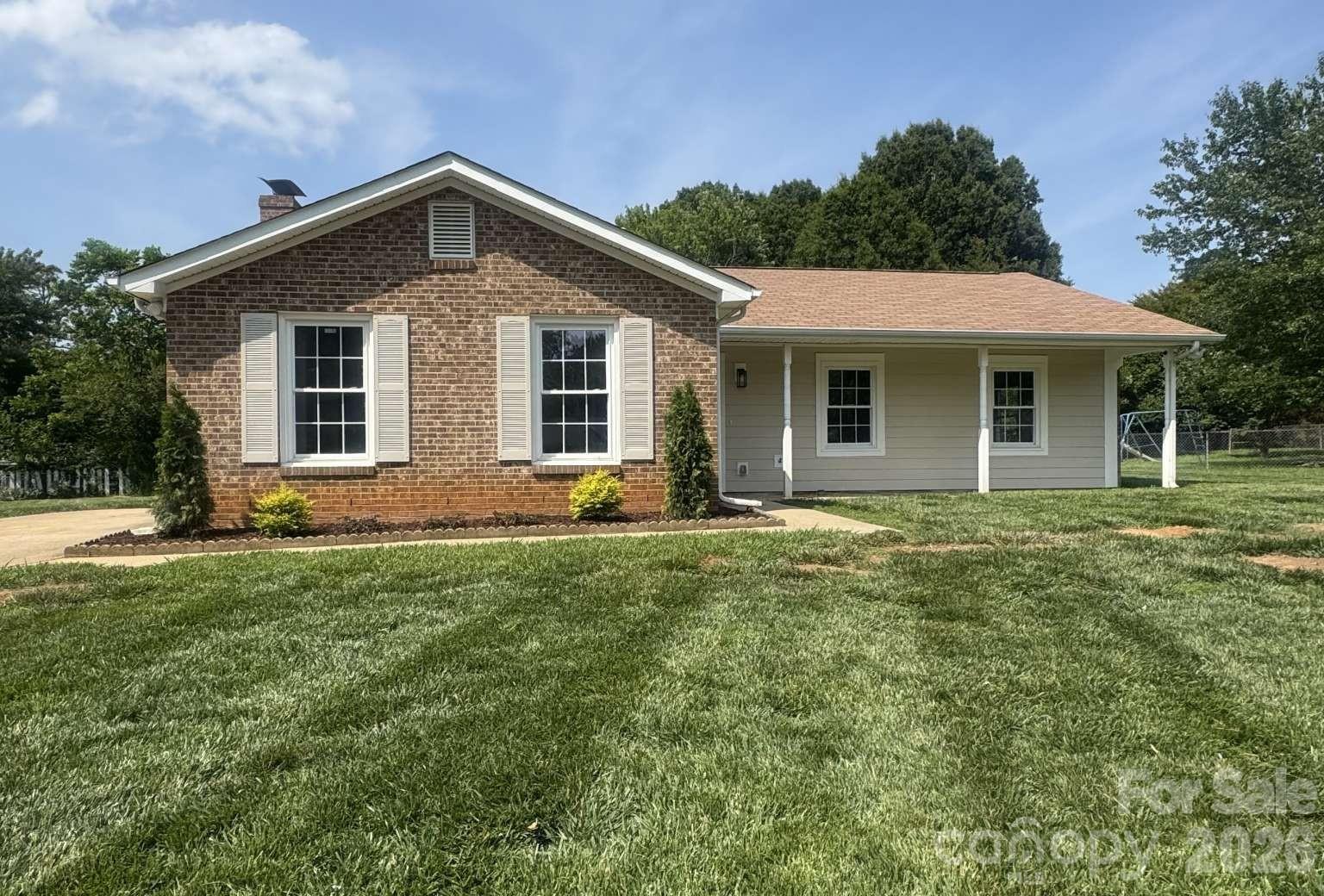 Completely renovated, move-in ready, and truly turn-key! This beautifully updated 4-bedroom, 2-bath home sits on a spacious cul-de-sac lot in an established Charlotte neighborhood with no HOA. Features include luxury vinyl plank flooring throughout, fresh interior paint, updated lighting, quartz countertops, shaker cabinets, designer tile backsplash, new stainless steel appliances, a large walk-in pantry, and a dedicated laundry room. The spacious living room showcases a painted brick fireplace, while both bathrooms have been fully remodeled with custom tile, quartz vanities, and modern fixtures. The private backyard offers plenty of room to relax or entertain. Conveniently located near shopping, dining, schools, parks, and major highways with easy access to Uptown Charlotte.