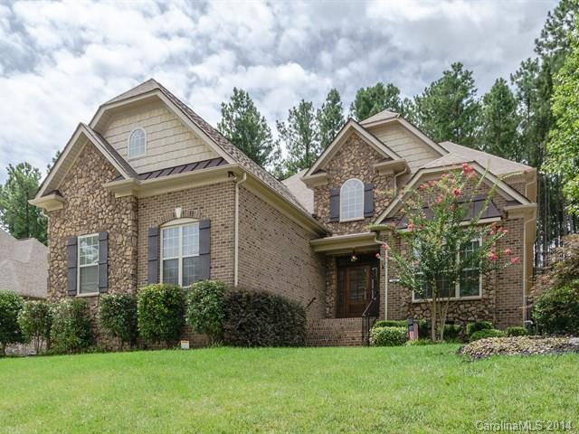 Priced way below tax value! Beautiful home one mile from Lake Wylie! Priced to sell! Master on main, formal dining & living. Great room has vaulted ceiling w/stone fireplace. Beautiful iron staircase. Kitchen has gas cook top, SS appliances. Hardwood floors throughout & security system. Prewired for surround sound. Large bonus could be used as 5th bedroom. Private backyard.  Neighborhood pool with walking trails & boat/RV storage. Only 26 miles from Charlotte Airport. Great Clover School system.
