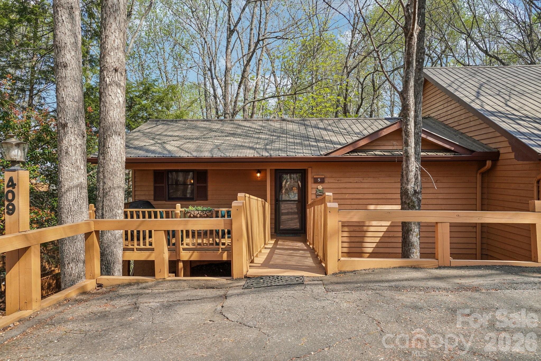Tucked within the desirable Bent Creek community of Rumbling Bald in Lake Lure, this well-maintained condo offers golf course and mountain views in a peaceful, resort-style setting—ideal for a second home, vacation retreat, or low-maintenance full-time living.

The main level features a spacious and functional layout with a primary bedroom, full bath, additional half bath, kitchen, dining area, living room, and convenient laundry—perfect for easy main-level living. Downstairs, you’ll find a private bedroom and full bath, creating an ideal space for visiting family and guests.

Enjoy outdoor living with decks on both the main and lower levels, perfect for relaxing with your morning coffee or unwinding in the evenings while taking in the scenic mountain surroundings.

Located within Rumbling Bald on Lake Lure, this home offers access to premier amenities including championship golf courses, lake access, walking trails, wellness center, and on-site dining—making it especially appealing for those seeking an active yet relaxed mountain lifestyle.

Whether you’re looking for a second home in Lake Lure, a retirement getaway in the North Carolina mountains, or a lock-and-leave property with resort amenities, this condo offers the perfect combination of comfort, convenience, and lifestyle. Rumbling Bald has an $11,000 initiation fee.

Home is being sold furnished.