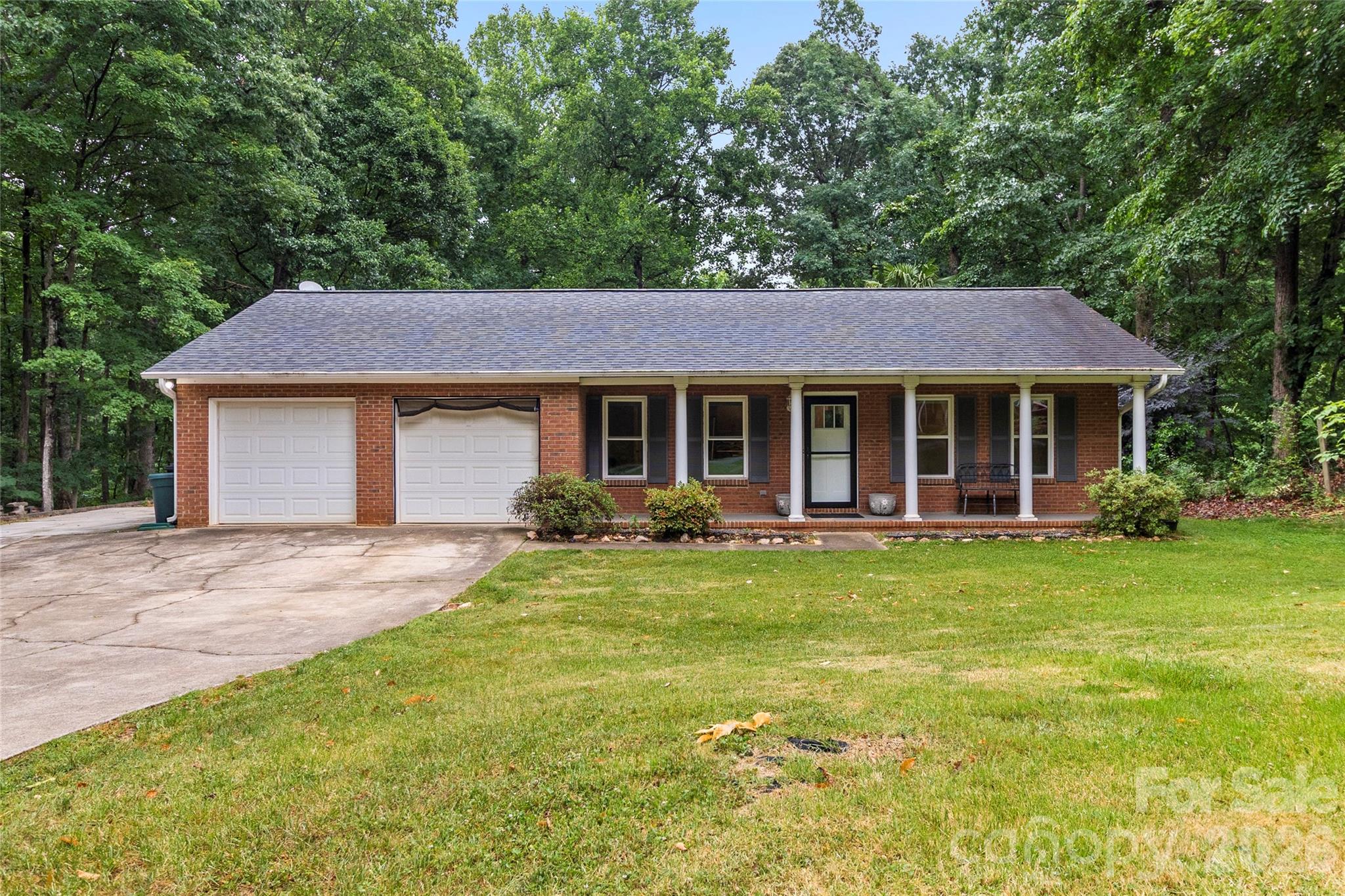 Welcome to your own slice of paradise! Nestled on 1.71 sprawling, picturesque acres with no HOA restrictions, this charming single-story, brick-front home offers the perfect blend of modern updates and serene, quiet country living. From the moment you arrive, the peaceful surroundings will make you feel right at home. As you walk through the front door, you'll appreciate that the the spacious great room boasts soaring vaulted ceilings, creating a bright and airy atmosphere that flows seamlessly into the wide-open, beautifully updated kitchen. The newly updated kitchen features stainless steel appliances, beautiful countertops, an abundance of cabinet storage, and is complete with a cozy breakfast bar that’s perfect for morning coffee or casual evening chats. This thoughtful layout features 3 spacious bedrooms and 2.5 baths, offering plenty of comfort and privacy for family and guests alike. Gorgeous, durable LVP flooring flows seamlessly throughout the main living areas. Relax in the expansive, sunlit den or retreat to the dedicated home office—ideal for remote work, a quiet reading nook, or even a playroom. The options are endless. If you love the outdoors, this backyard is a dream come true. The living space extends effortlessly outside onto a huge back deck, perfect for hosting summer barbecues or simply soaking in the quiet twilight hours. The expansive, fenced yard provides a secure haven for pets and play, while the sprawling acreage offers endless possibilities for gardening or stargazing. Plus, DIY enthusiasts and hobbyists will fall in love with the detached storage shed equipped with electricity—ready for your next project, workshop, or potting shed. Enjoy the ultimate freedom of acreage and no HOA, all while wrapped in the comfort of a beautifully modernized, classic home. Come see this rare find before it's gone.
