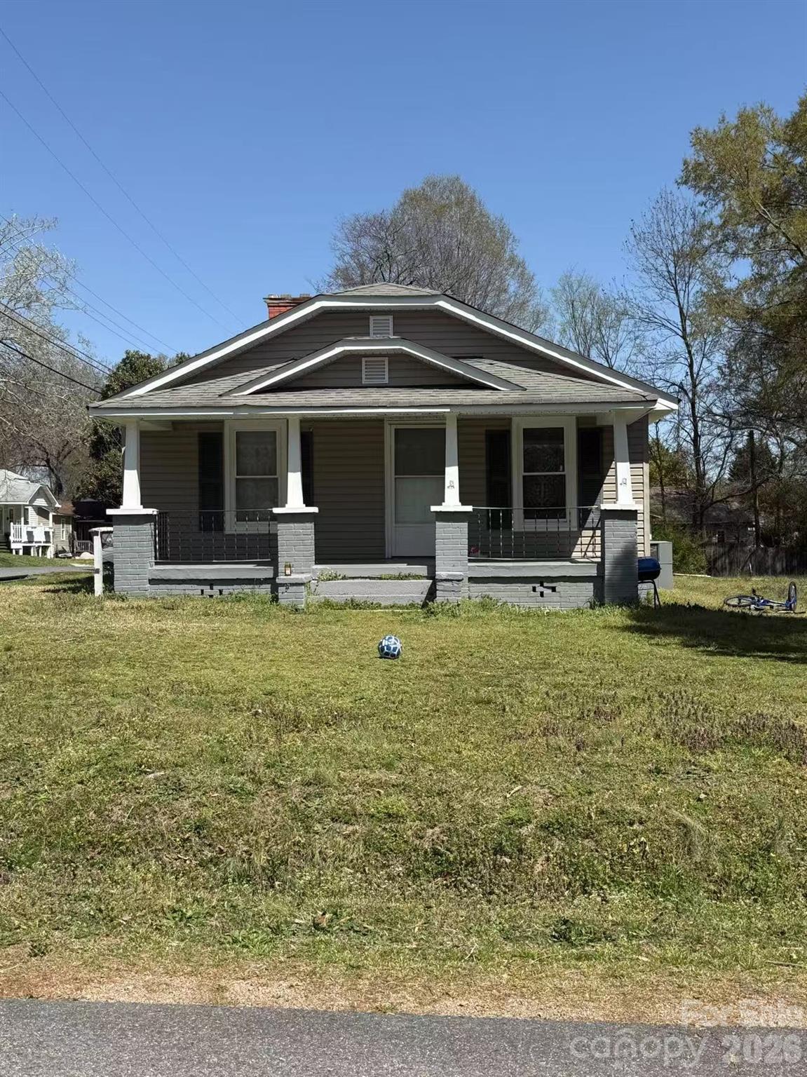 Charming home featuring a welcoming rocking chair front porch. Newer AC and water heater. Kitchen and bathroom have been recently renovated, and windows have been replaced. The roof is approximately 10 years old per the previous owner. Property is being sold as-is.