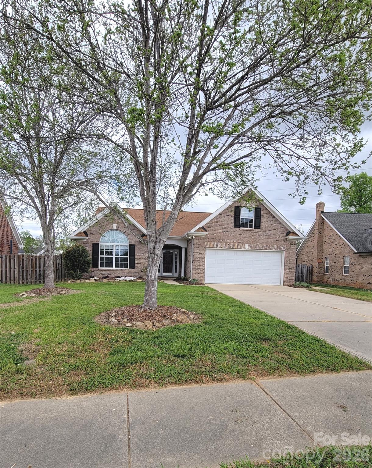 Full Brick Home, Convenient Location,  Walkable to Rob Wallace Park,  This is an inviting home with a bright and airy sunroom—perfect for relaxing mornings or evening gatherings. The spacious kitchen offers ample room for cooking and entertaining, while the large living room with a fireplace provides a comfortable, open space for family and friends to gather. This home blends traditional charm with modern comfort. The Wide Entry could be decorated or used in a variety of ways and features tile flooring for easy maintenance. The Living room opens to Dining area.  The Kitchen has an abundance of cabinets, appliances already in place and remain.  Laundry is a separate room the washer and dryer are also already there!  Bonus room over the garage could have a variety of uses. Seller added a mini split unit for better temperature enjoyment.  Nice Patio off the Sunroom and a fenced yard enhance the yard. Seller also offering one year home warranty through America's Preferred Home Warranty.  This home backs to a common area of the Midland Crossings neighborhood.