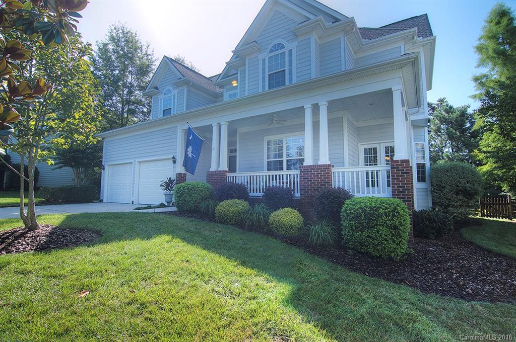 This beautiful home is a MUST SEE. Neutral paint throughout. Hardwoods on main level. Open floor plan. Kitchen with tile backsplash & work island. Dining room & great room with built ins. Surround sound in great room & deck. Spacious master on main. New custom tiled shower in master bath with frameless enclosure. Bed/bonus on upper level. Laundry room w/sink. Wrap around porch. New roof in 2011. Professional landscaping. Tega Cay vacation lifestyle. Fort Mill Schools.
