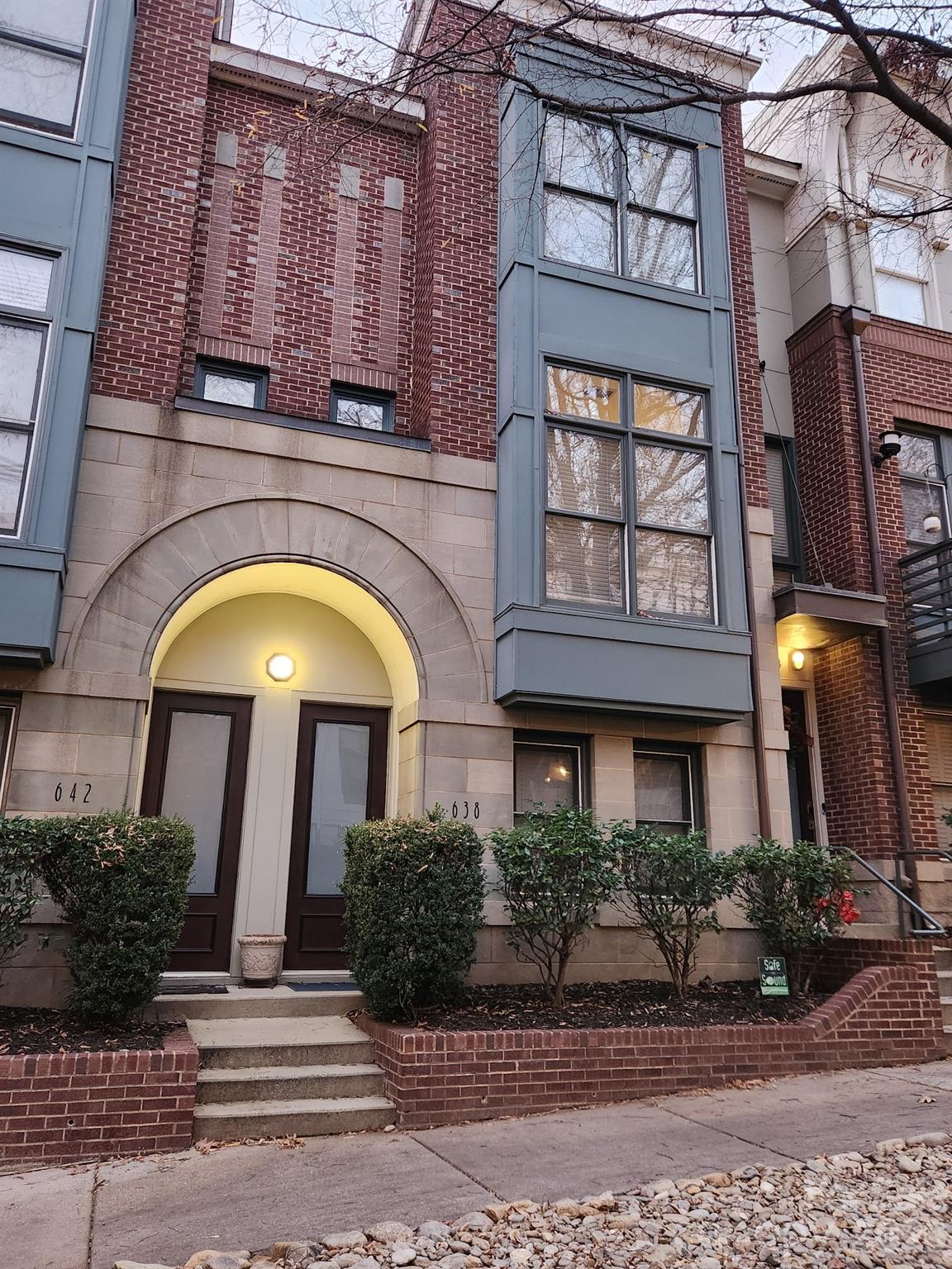 Major Price Improvement! Enjoy stunning skyline views from the rooftop terrace, complete with a wet bar, in this well-maintained and updated townhome. Ideally located in the highly sought-after First Ward neighborhood, just blocks from the Light Rail, First Ward Park, Spectrum Center, and more. Easy access to NODA, Plaza Midwood and Optimist Hall. This tri-level townhome offers 3 bedrooms and 2.5 bathrooms, featuring a remodeled kitchen with a raised island bar, stainless steel appliances, granite countertops, and ample soft-close cabinetry. The open-concept layout is perfect for entertaining, with a conveniently located half bath just off the kitchen. The updated primary bathroom boasts a spacious tiled shower with granite accents, dual-sink vanity, and a built-in makeup nook/alcove. The lower-level bedroom includes a full ensuite bath, making it ideal for guests or a private office. Additional highlights include a rear-entry, off-street garage with space for one vehicle plus extra storage.