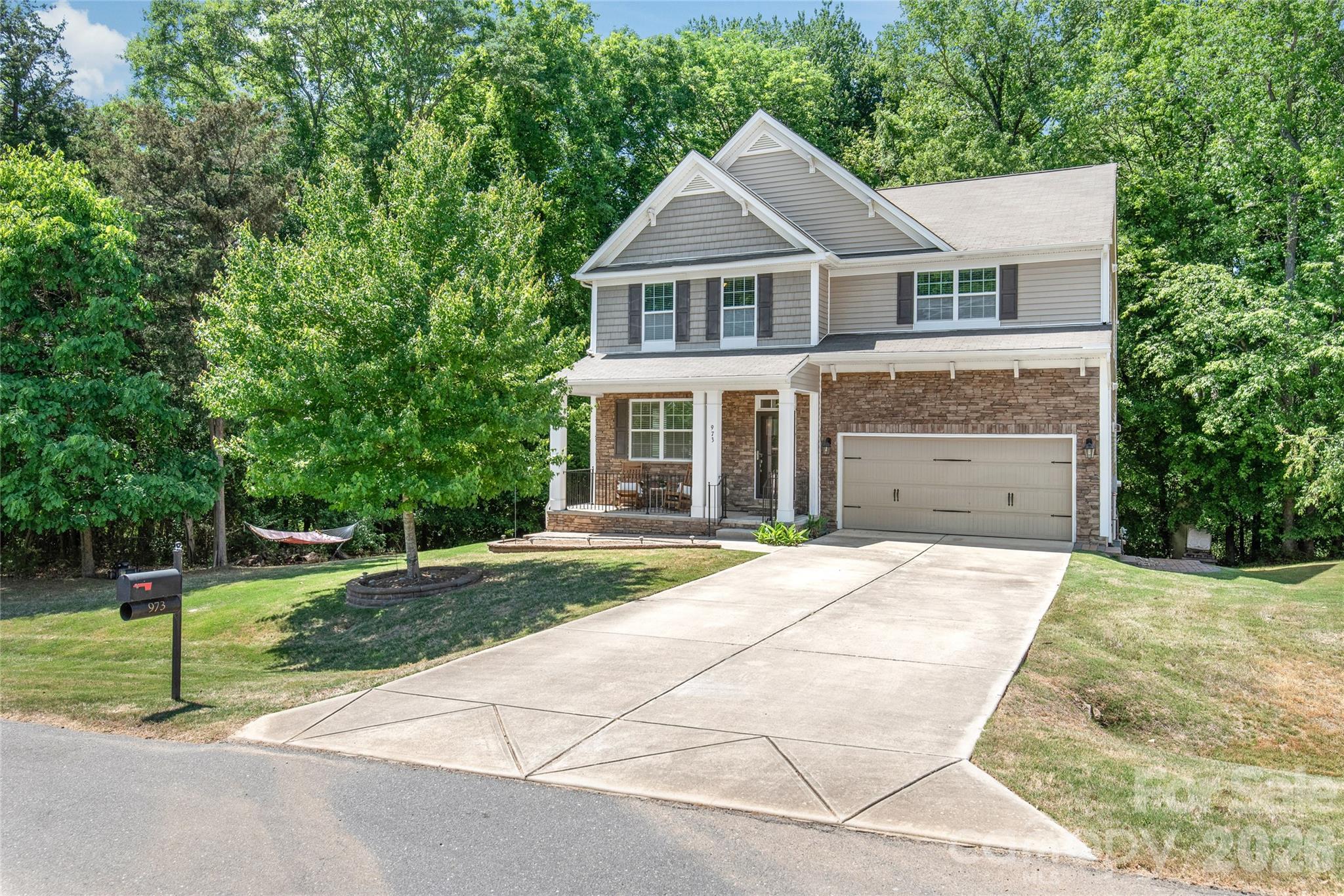 Tucked away at the end of a quiet cul-de-sac, this inviting home offers the perfect blend of secluded privacy and effortless access to the vibrant Lake Wylie lifestyle. Imagine starting your day in an airy, open-concept living space perfect for both quiet mornings and hosting friends. With five spacious bedrooms and three full baths, the layout provides a dedicated sanctuary for everyone, while the expansive half-acre lot serves as your own private wooded retreat for gardening or outdoor play. The home's thoughtful updates, including an energy-efficient insulated attic, ensure year-round comfort, while the massive 1,343-square-foot unfinished walk-up basement stands as a rare blank canvas ready to be transformed into your dream gym, workshop, or cinema. Just minutes from local docks, dining, and boat ramps, this is more than just a house—it’s an opportunity to settle into a peaceful community where you can truly breathe and build the lifestyle you’ve been looking for.