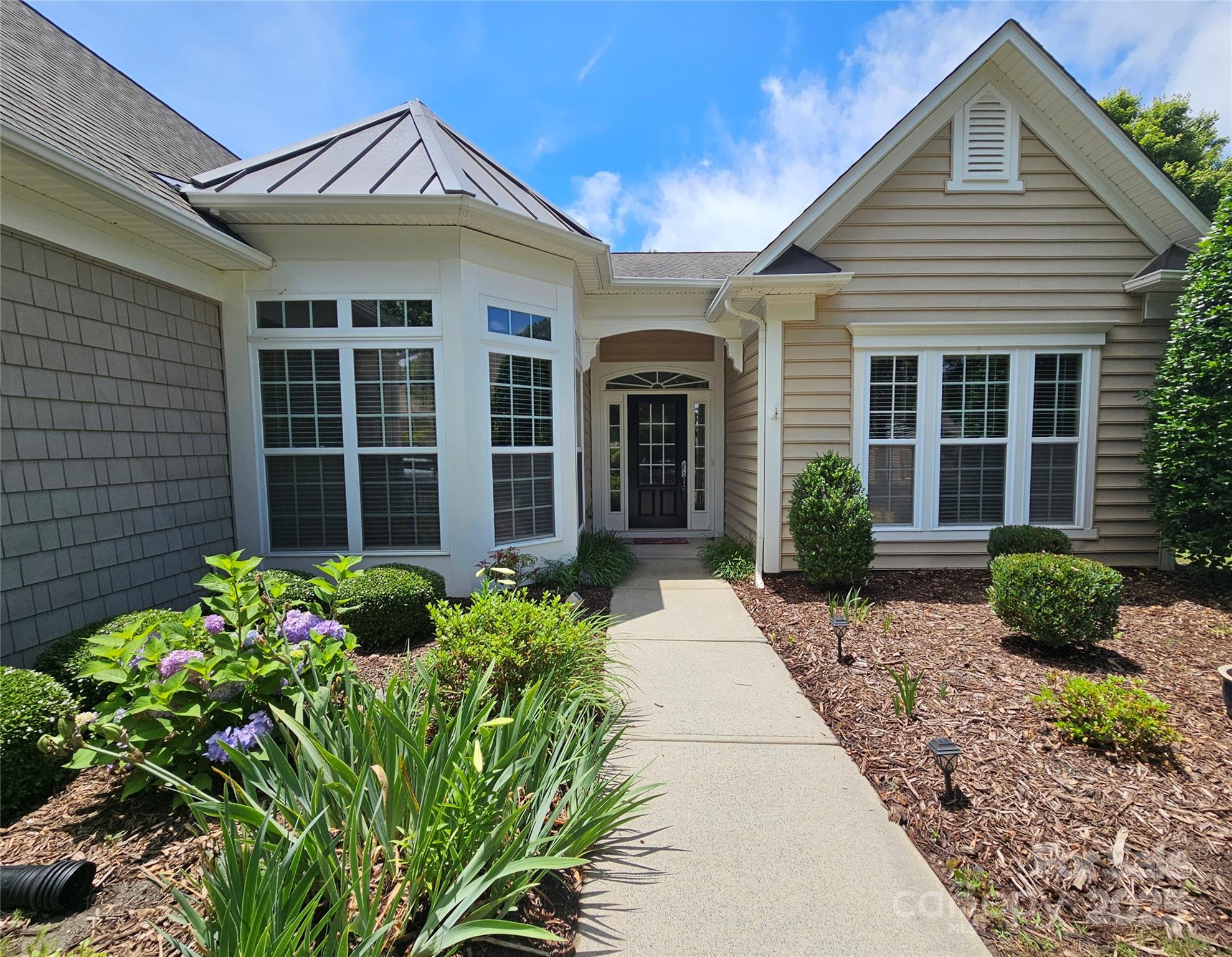Sought after Cumberland Hall 3BR/2.5BA plan! This lovely one-level home features fresh paint, new carpet, and beautiful new laminate wood floors, all 2025! Water heater(2023), HVAC(2022). This home also has an office w glass doors & a 3-season room. Large windows bring in natural light & the open floor plan includes a kitchen w an island, bar top, pantry, & stainless appliances. The living room has a gas fireplace. A split-bedroom layout offers a private primary suite with a trey ceiling, double vanity, shower, separate tub, linen closet, and large walk-in closet. Two additional bedrooms share a bath. The home backs to the golf course, providing privacy. Enjoy outdoor spaces w a covered front entrance, rear patio, and 3-season room w vinyl windows & AC. The 2-car garage features an insulated door, keypad entry, and pegboards. Active Sun City community offers pools, fitness centers, clubhouses, tennis, pickleball, bocce, trails, clubs & more! Golf memb. avail w discounts for residents.