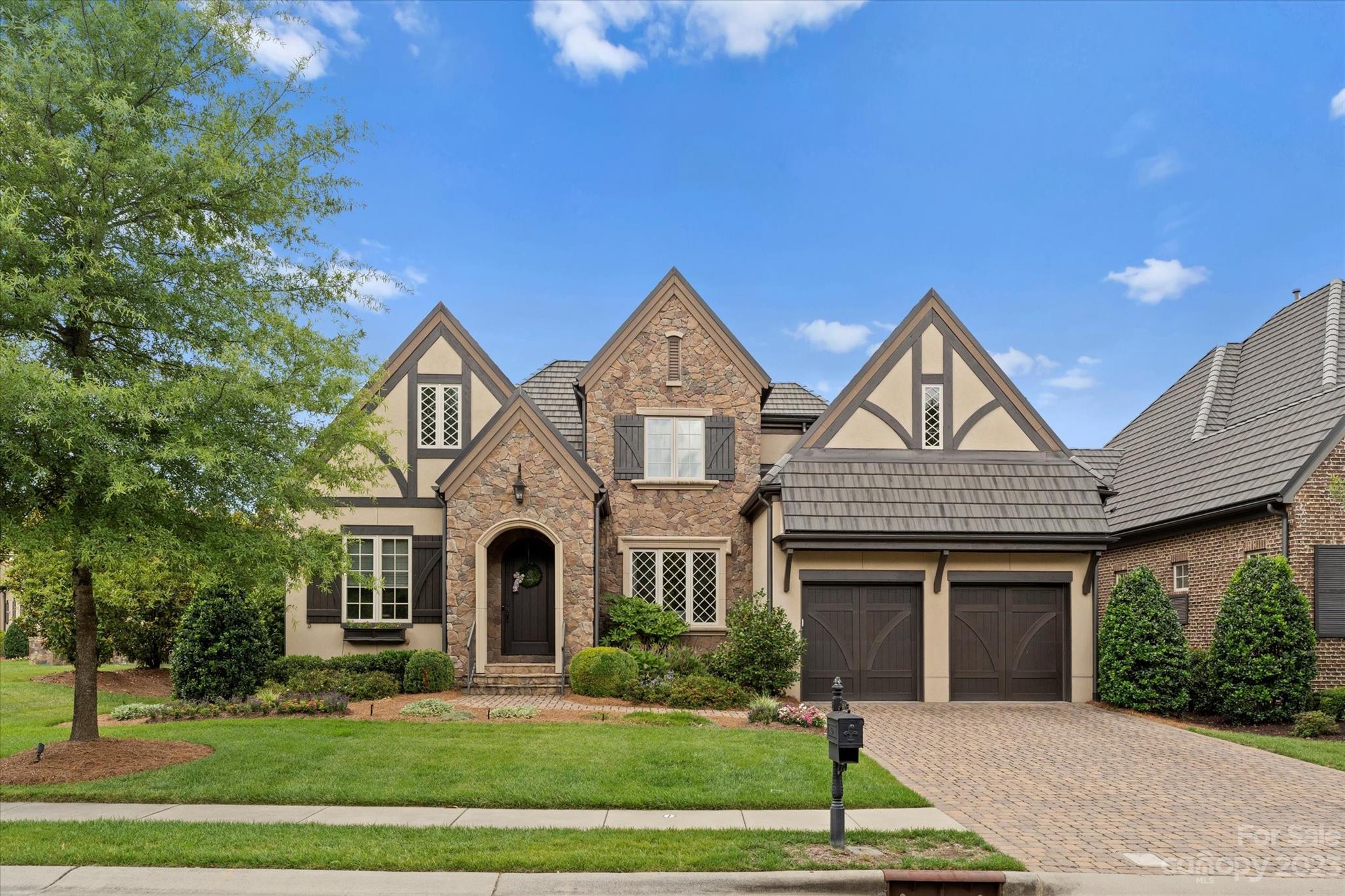 Welcome to this enchanting home nestled within the gated Longview community. Step into a world of elegance & comfort as you explore this charming residence, complete with flowerboxes & private backyard.  As you enter you'll notice the seamless flow& inviting atmosphere. The heart of the home lies in its open-concept kitchen which is a chef's dream, boasting high-end stainless steel appliances, ample storage space, & large center island perfect for entertaining. The great room has soaring ceilings & access to the covered back porch. A desirable guest room and office on main. The primary suite on main provides a tranquil retreat for homeowners, featuring a luxurious en-suite bathroom with double vanities, tub, a separate shower, and a generously-sized walk-in closet. Secondary bedrooms up with en-suits, 2 bonus rooms & generous walk-in attic for storage. Don't forget to see the custom wine closet! Tesla Charger on tandem side of garage. Award winning schools. Social Membership required.