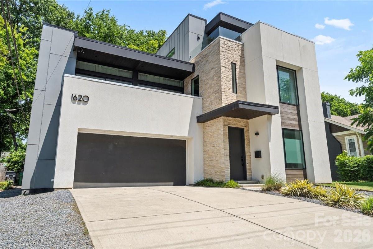 Experience elevated urban living in this one-of-a-kind modern residence in the heart of South End, Charlotte. Thoughtfully designed and custom-built, this home offers expansive open-concept living, soaring 12-foot ceilings, and striking cantilevered “floating” stairs. Elegant European white oak hardwood floors flow throughout, complemented by a private outdoor oasis perfect for relaxing or entertaining.
The sleek, minimalist kitchen features premium Miele appliances, a waterfall island, and high-end European cabinetry. The luxurious primary suite includes a spa-like bathroom with a walk-in rainfall shower and custom dual closets by California Closets.
Located just steps from the LYNX Blue Line and within walking distance to top restaurants, breweries, and boutiques, this home delivers unmatched convenience and lifestyle. Zoned for a highly rated school district and designated TOD-NC (Transit-Oriented Development – Neighborhood Center), it offers exceptional flexibility for both residential and commercial use.

Currently operating as a successful short-term rental generating approximately $150K annually, this turnkey property presents a rare opportunity for immediate income. Ideal for homeowners and investors alike—don’t miss this exceptional offering!