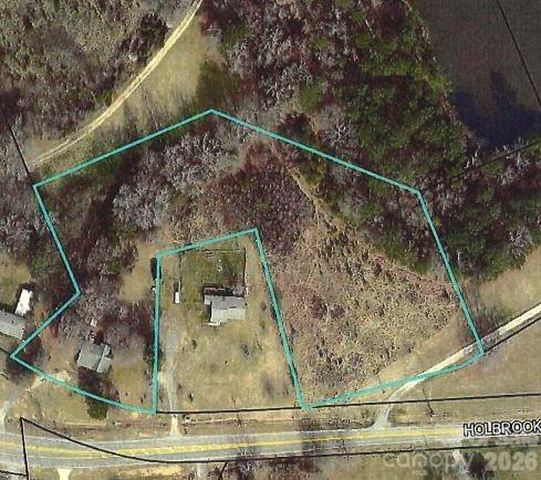 Prime Development Opportunity – 3+ Acres in High-Growth Fort Mill Area

Rare opportunity to acquire more than 3 acres at a highly visible, busy intersection near Fort Mill Parkway and Holbrook Road (Doby's Bridge Road). Ideally situated directly across from Atrium medical offices and the new Harris Teeter shopping center, this property offers excellent exposure and convenient access to surrounding retail, dining, and professional services.

Located in one of Fort Mill's fastest-growing corridors, the site provides easy access to both Charlotte and Rock Hill, making it well-positioned for a variety of potential uses, subject to zoning and approvals.

The property is being marketed for land value only. An older home is located on the site and is considered to have no contributory value. The property is currently zoned RD-II.