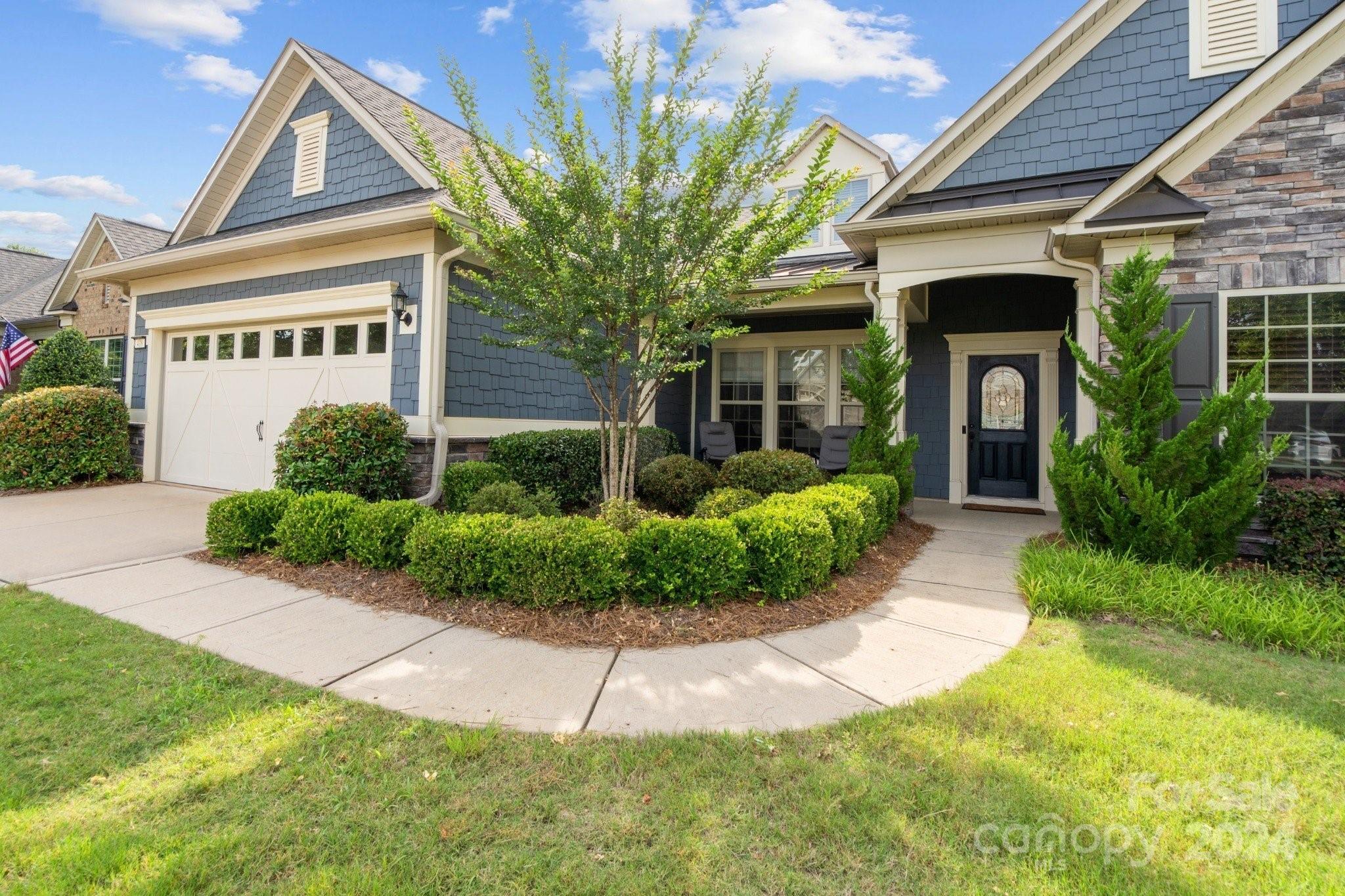 Welcome home to your 2 level Tangerly Oak model in the award winning 55+ community of Carolina Orchards. 3 BR 3.5 Baths. Primary suite & 2nd BR/dual primary on main. Upgraded Kit w/double ovens, ss app, gas cooktop, ss direct-vent hood, Instant hot water at sink, ref included, walk-in pantry. Open concept living, great for indoor/outdoor entertaining. Great rm w/stone fireplace, Sunrm leading to 3 season rm leading to patio & back yard. 1st floor Laundry w/cabinets, sink, washer/dryer included. Drop Zone leading to 4' extended 2 car + tandem Garage, utility sink, tankless water heater, walk-up attic storage. 2nd level w/loft, 3rd BR, 3rd full bath. Lawn maintenance included. Tons of amenities--indoor/outdoor pools & hot tubs, 8 lit pickleball cts, 4 lit tennis cts, 2 bocce cts, dog park, playground, fitness center, aerobics rm, ball rms, meeting rms, full-time activities director w/lots of activities & clubs to choose from. Come join us in the Orchards. It's a great place to call home.