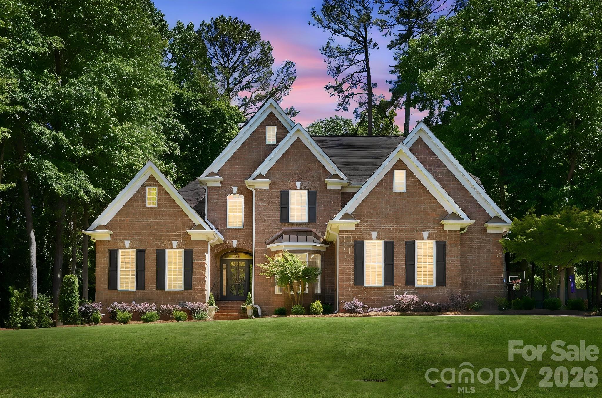 Properties like this don't hit the market often and you are not going to want to miss this one. Stunning all-brick home nestled in the highly desirable community of Heathwood Forest, situated on nearly half an acre! This beautifully and expertly maintained home features an inviting open floor plan with elegant finishes throughout with architectural lighting around the entire home. The main level includes a spacious formal dining room, formal living room, a gorgeous eat-in chef's kitchen complete with granite countertops, stainless steel appliances, breakfast bar seating, and seamless flow into the great room featuring a cozy gas-log fireplace.

The luxurious owner’s suite is conveniently located on the main floor and boasts a tray ceiling, dual vanities, water closet, separate shower, and an oversized walk-in closet. The owner’s bath also features its own dedicated tankless water heater, providing endless hot water and added convenience.

Upstairs, you’ll find four additional bedrooms and a spacious bonus room perfect for a flex space, media room, playroom, or home office.

Enjoy year-round relaxation in the sunroom surrounded by stunning windows, or unwind outdoors by the charming brick fireplace. The backyard is designed for both entertaining and everyday enjoyment with landscaping updates, featuring an irrigation system, fenced pet area, and even a private putting green.

This rare find, loaded with extraordinary upgrades,  offers the perfect combination of comfort, space, and location — just 7 minutes from Downtown Rock Hill, with easy access to restaurants, shopping, and more!