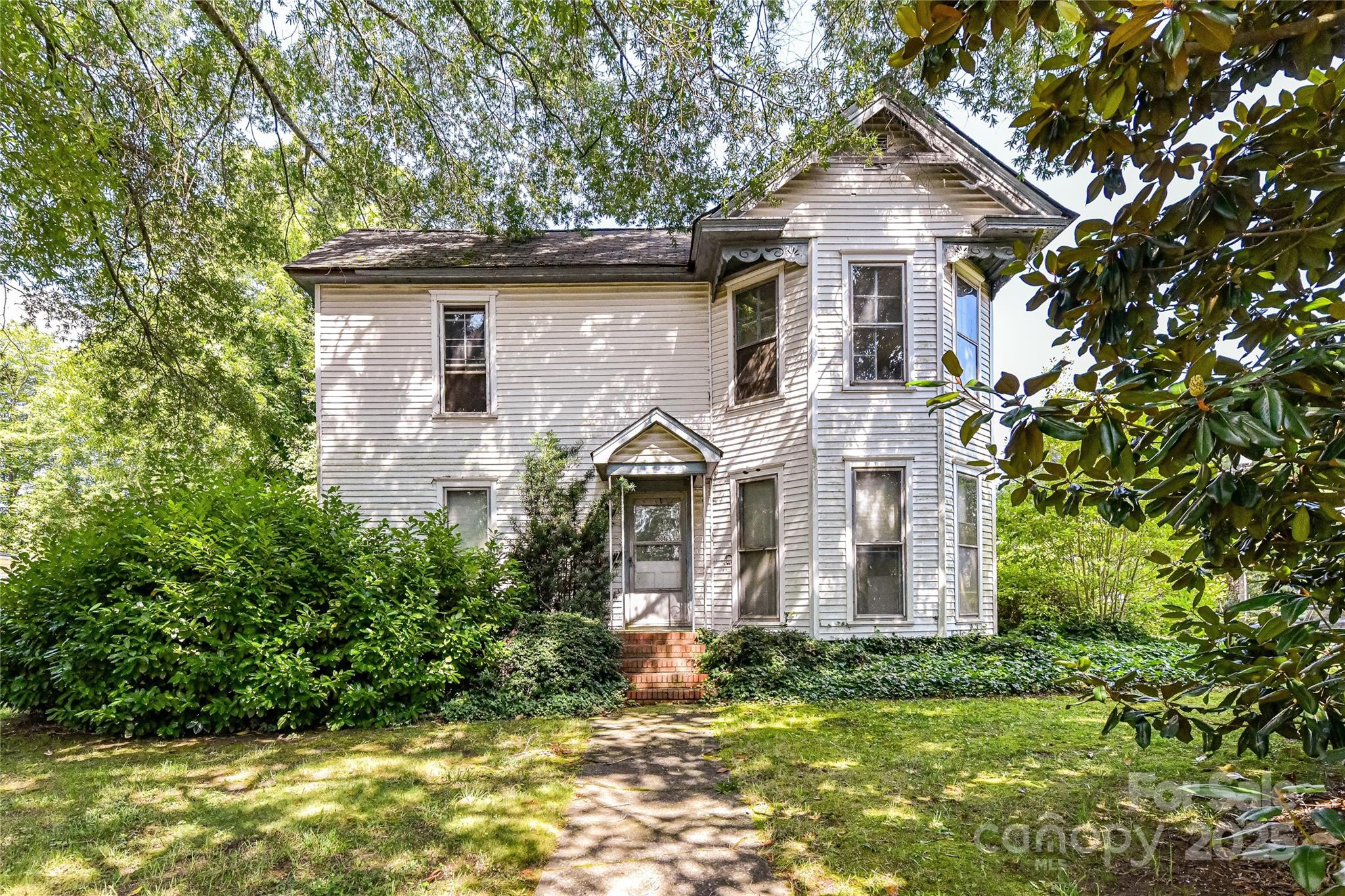 Beautiful, level .645 acre parcel at the corner of Potts Street & Catawba Avenue in Davidson! Currently has a home built in 1910 with 2452 heated square feet. One option would be to renovate the home and subdivide the rear of parcel into 2 buildable lots. Regardless, at this price, the property's main value is in the land for a Minor Exempt Subdivision (up to 3 lots on a parcel less than 2 acres). The property is located in the Village Infill Zoning Area & Orange Overlay District. It has 300' of road footage on Catawba Avenue and 100' of road frontage on Potts Street. Appears to set up nicely for three lots with 100' frontage each and rear depth of 100' - roughly .215 acres each.  
One block from South Main Street in Davidson. Great opportunity for a custom builder or an investor in Davidson.