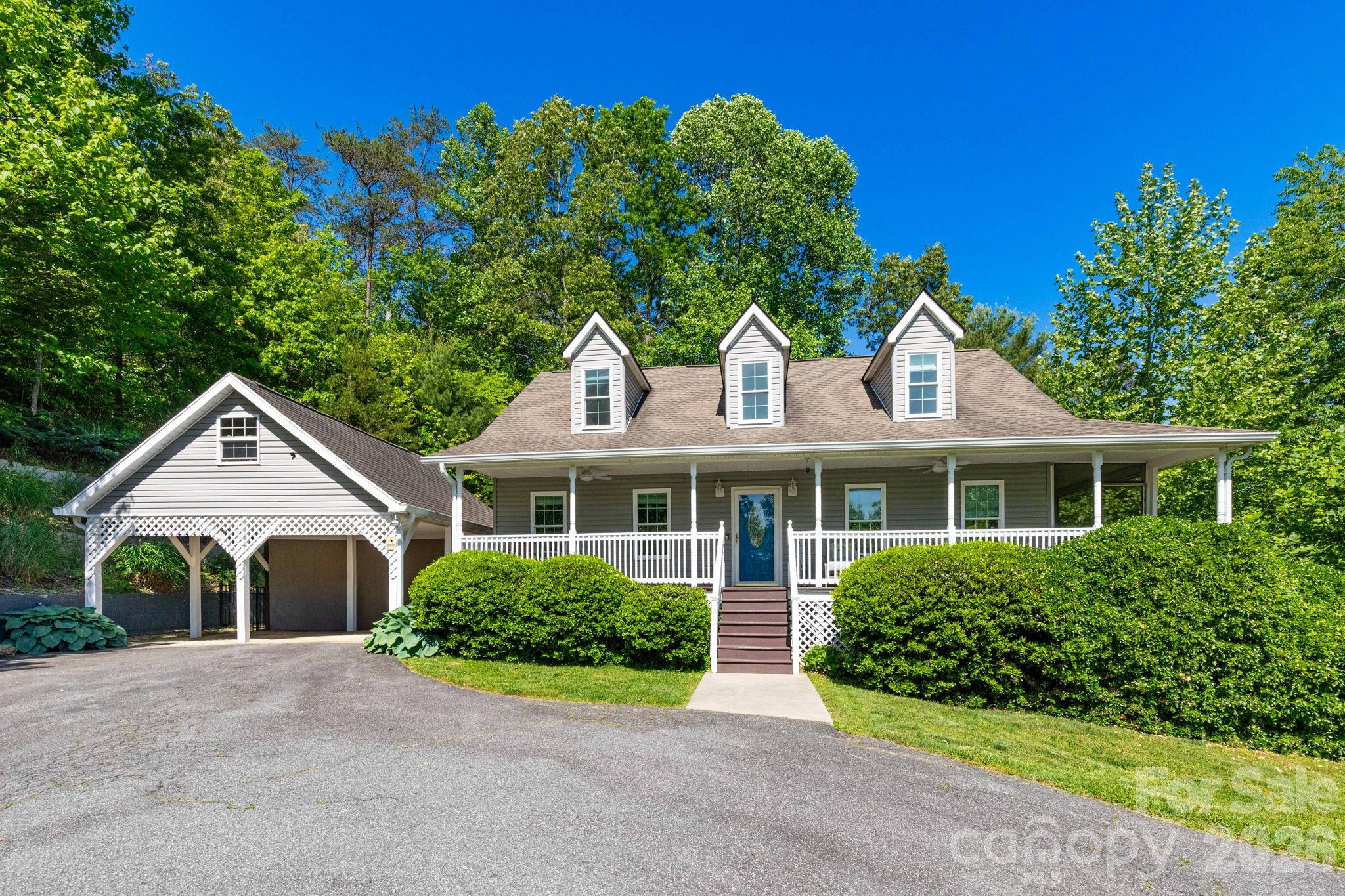 This turnkey mountain retreat offers the perfect blend of comfortable everyday living and flexible space for multigenerational households, guests, or as a short-term rental. This thoughtfully designed property features two distinct living areas, providing room to spread out while still feeling connected.
The main level features an open floorplan with spacious living and dining areas designed for gathering and entertaining. A large dining space and wraparound breakfast bar provide multiple dining options. The kitchen is equipped with stainless steel appliances, dual recessed sink and tile backsplash. The main-level primary suite includes a fully remodeled ensuite bathroom with soaking tub, tile shower, dual vanity and walk-in closet. An additional half bath completes the main floor.
Upstairs offers 2 additional bedrooms and a full bathroom that has also been fully remodeled. New flooring throughout the home adds a fresh, updated feel.
The fully finished basement significantly expands the home's functionality with a second living room, large family/game room with kitchenette, 4th bonus sleeping room and full bathroom. With both interior access and a separate exterior entrance, the lower level creates an ideal setup for multigenerational living, guest quarters, private space for older children or long-term visitors.
Outdoor living spaces are equally inviting with a large covered front porch showcasing winter mountain views, back deck overlooking the fenced backyard, firepit area, storage shed and 2 covered patio spaces, including one with a hot tub.
Tucked away in a quiet, established neighborhood just minutes from local restaurants and Noble Cider. Conveniently situated approximately 15 minutes to West Asheville and 20 minutes to downtown Asheville, offering easy access to shopping, dining, entertainment and outdoor recreation while still enjoying a peaceful residential setting.
Currently operating as a successful short-term rental with bookings through June, the home can also be sold furnished, offering additional flexibility for buyers seeking a turnkey transition.