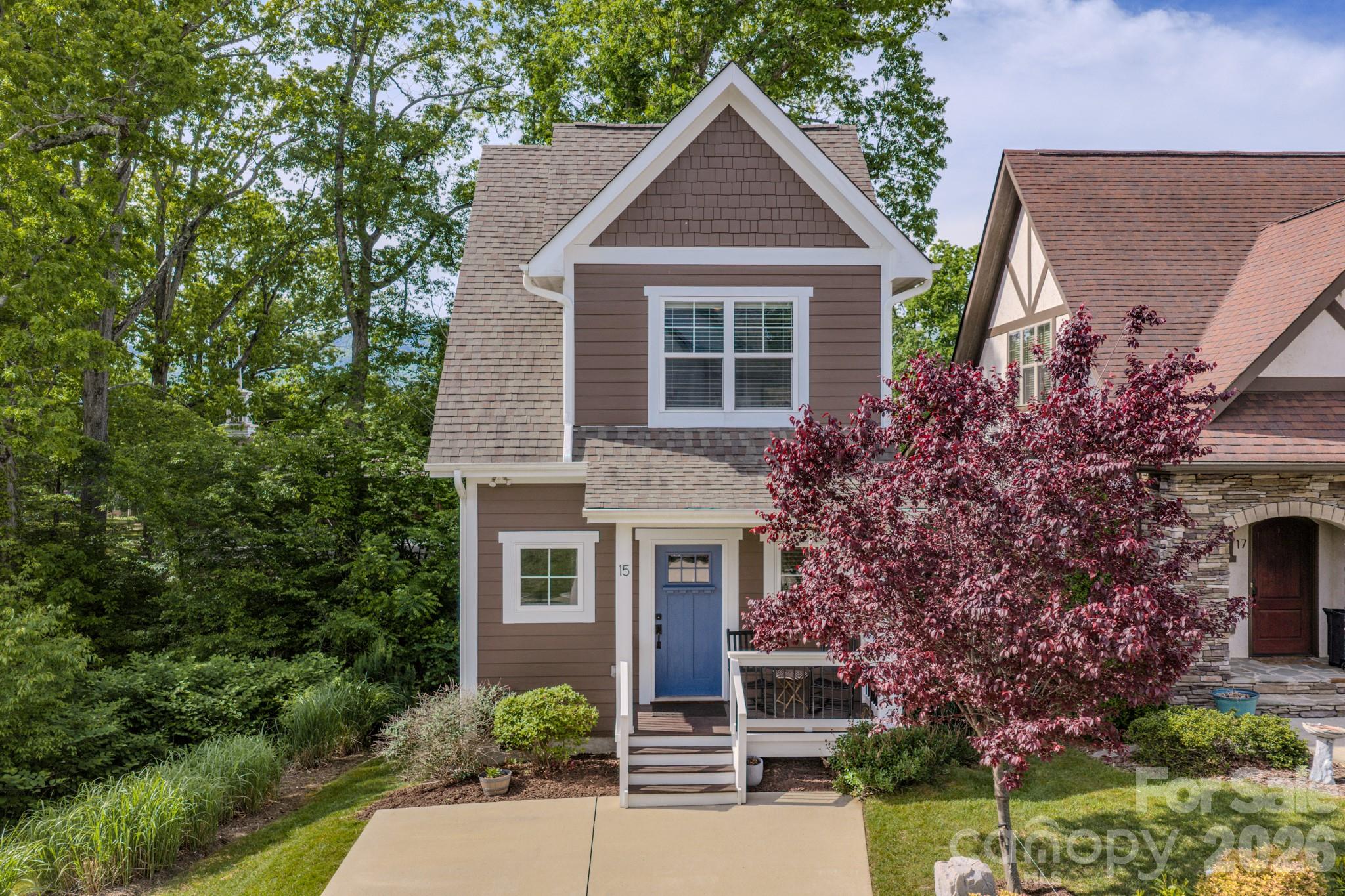 Experience the pinnacle of low-maintenance luxury in this immaculate 2-bedroom, 1.5-bathroom home, built in 2019. Situated in one of the area's most coveted communities, Tudor Croft, this residence offers a rare turnkey opportunity for those seeking a sophisticated primary residence, a serene second home, or an investment property. The interior is absolute perfection—immaculate, light-filled, and showing like a brand-new model home. At the heart of the living space, a cozy gas fireplace serves as the focal point for chilly evenings. The thoughtful layout maximizes every square foot, ensuring comfort and style are never compromised. Outdoor living is where this property truly shines. Enjoy your morning coffee on the charming front porch or retreat to the covered back deck to take in the mountain views. Location is everything. Just minutes from the pristine greens of the Black Mountain golf course and the tranquility of Lake Tomahawk with quick access to the vibrant shops, dining, and culture of downtown Black Mountain. With short-term rentals allowed, you can capitalize on the robust local tourism market when you aren't enjoying the home yourself. Properties of this caliber—offering modern 2019 construction, "like-new" interiors, and mountain vistas—are a rare find in this market. Schedule your showing today and step into perfection.