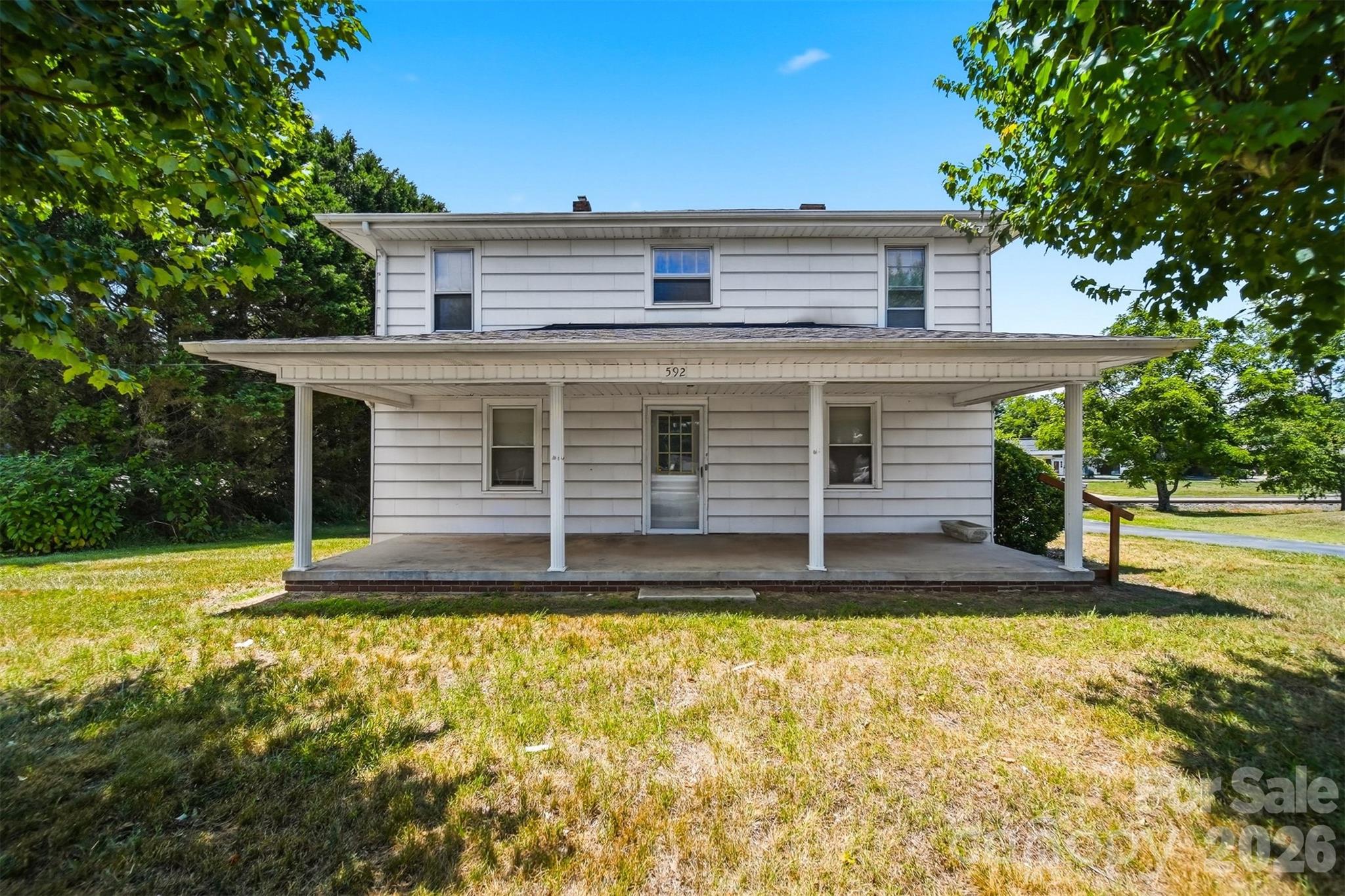 Here is your opportunity to take a farmhouse and make it your own! Conveniently located on 321-A, you can enjoy all that downtown Hudson has to offer. On the main level, you will find a nice sized living room, a large kitchen, a cozy den, a full bath and an enclosed back porch. Upstairs, there are 4 bedrooms. Because the home is surrounded by commercial properties, you may also want to check with Town of Hudson zoning about applying to make this a commercial property which would open up an abundance of other opportunities! Call today for your private showing!