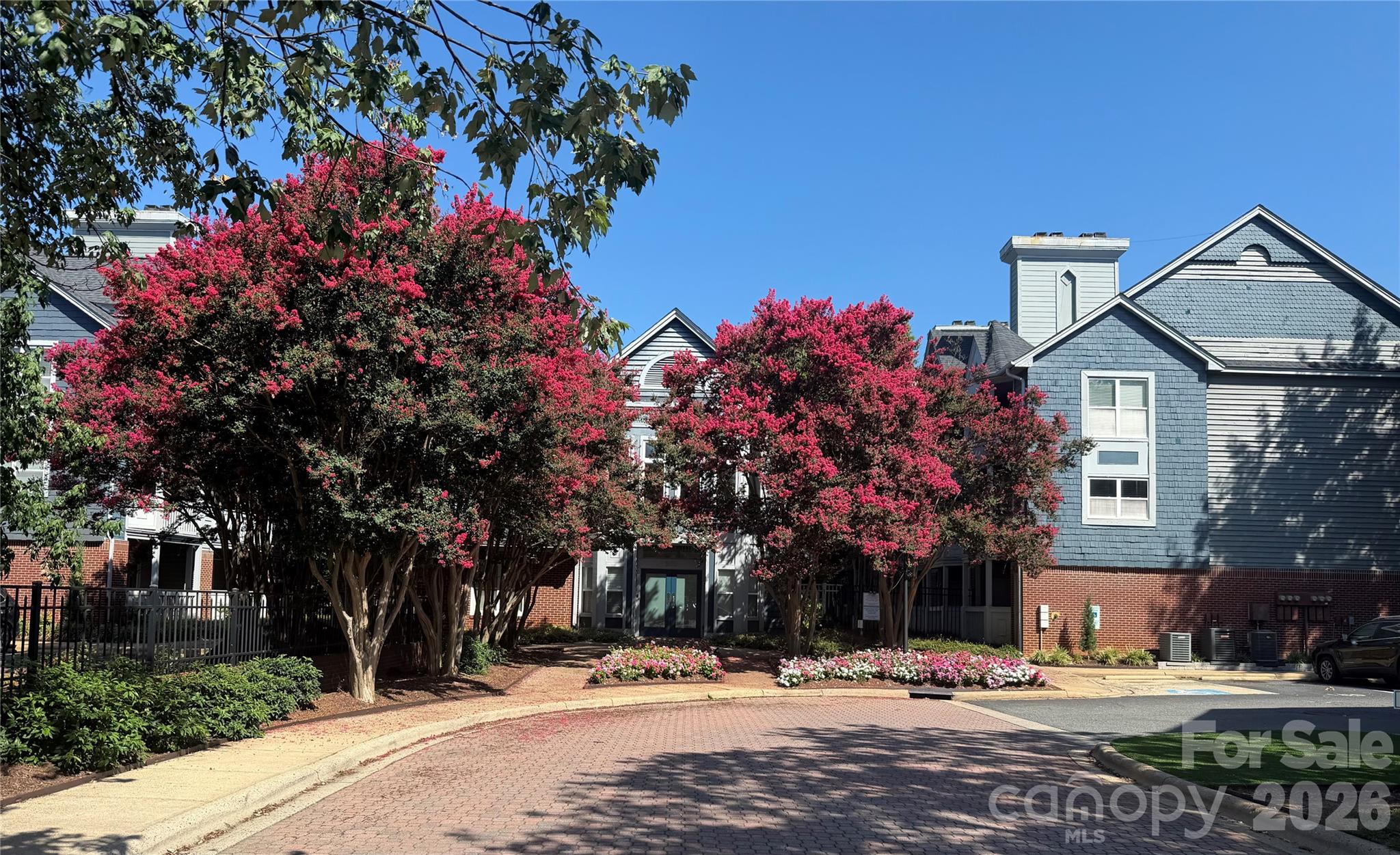 Experience refined urban living in Fourth Ward Square, one of Uptown’s most coveted addresses. Perfectly positioned in the heart of Charlotte, this impeccably maintained second-floor residence offers effortless access to premier dining, cultural destinations, and the vibrant energy of city life, while providing a serene retreat to call home.

Inside, the thoughtfully designed open-concept layout seamlessly connects the kitchen, dining and living areas, creating an inviting space that's ideal for entertaining. Elegant cabinetry, abundant natural light, a fireplace and a covered balcony (with storage closet!) overlooking the community pool elevate the everyday experience...just imagine slow mornings with coffee and evenings unwinding! The spacious bedroom features a generous walk-in closet, with space for all your belongings. With a stackable washer and dryer, along with all kitchen appliances, conveying, fresh paint, and new bedroom carpet, this unit makes for a truly turnkey opportunity.

Residents of Fourth Ward Square enjoy resort-style amenities including an outdoor pool, fire pit lounge, picnic areas, a well-appointed clubhouse and a fitness center. Sophisticated, low-maintenance living in an unbeatable Uptown location, this is luxury made effortless!