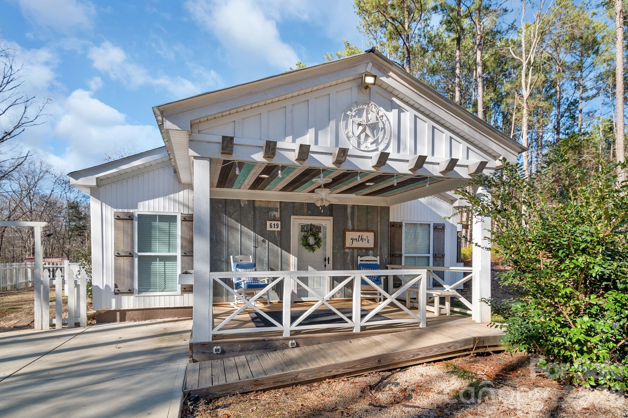 Bring your offer - enjoy privacy, space, and flexibility with this 2-bedroom, 2-bath home situated on 2.15 acres in a prime location with no HOA, featuring a desirable split-bedroom floor plan. Plus, a spacious flex room offers endless possibilities and could easily serve as a third bedroom, home office, or bonus space.

As you enter the home, you are welcomed by a generously sized bedroom, followed by an additional flex room—which can serve perfectly as a 3rd bedroom.  A full bathroom is conveniently located nearby and leads seamlessly into the heart of the home: a large open living area, a spacious living room with cathedral ceiling, and a dining area that flows effortlessly into the kitchen—ideal for everyday living and entertaining.

Just off the kitchen, you’ll find a laundry room that connects to a large walk-in closet, offering excellent storage and the option to use it as a pantry or additional primary closet. Off the living room and closet is the primary bedroom, complete with an ensuite bathroom featuring a walk-in shower, tub, and a large walk-in closet.

Step outside from the kitchen onto a screened-in porch, perfectly nestled along the side of the home for relaxing and enjoying the peaceful surroundings. The property also includes a large detached outbuilding with power and its own subpanel, plus a second-level storage area. Two additional outbuildings/sheds provide endless possibilities—workshop, storage, home office, or future guest or granny pod conversion.

Conveniently located near US-521 / Hwy 9, shopping, dining, University of South Carolina Lancaster, and MUSC Health Lancaster Medical Center, this property offers the perfect blend of space, flexibility, and accessibility.