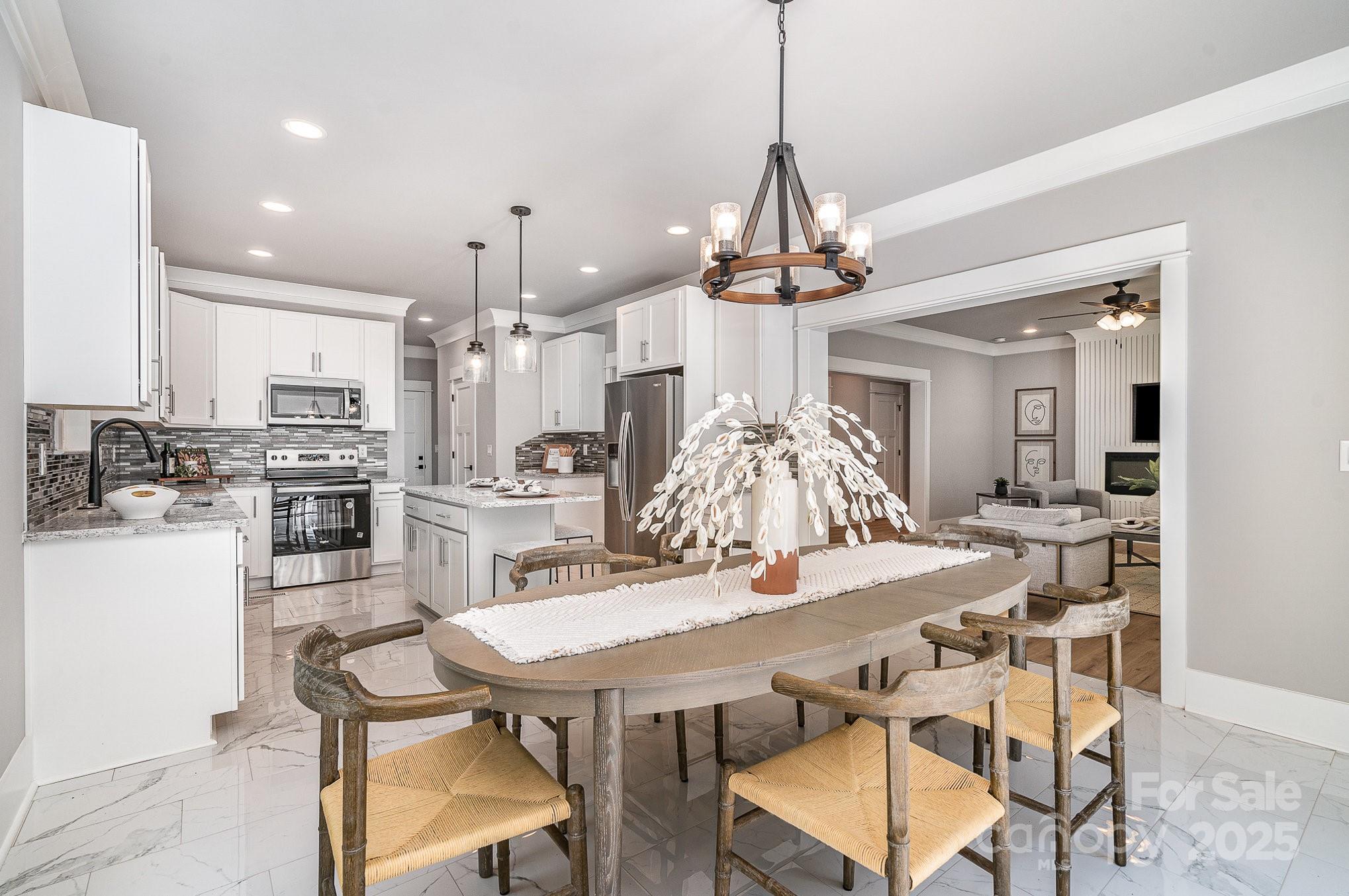 Welcome to this stunning new construction home in the highly desirable Edgewater community of Sherrills Ford, NC. Built in 2025, this two-story single-family residence offers the perfect blend of modern design, high-end finishes, and functional living space.
With 4 bedrooms, 3.5 bathrooms, and over 4,000 square feet of living area, this home delivers spacious open-concept living ideal for a variety of lifestyles. The main level features durable luxury vinyl plank (LVP) flooring, a flexible front room that can be used as a formal dining area, home office, or study, and a beautifully appointed gourmet kitchen with shaker-style cabinetry, granite countertops, stainless steel appliances, and an island—perfect for everyday meals or entertaining.
The main-level primary suite offers both privacy and accessibility, complete with a well-designed ensuite bath. Upstairs, you’ll find a large bonus room, ideal for a media room, game room, or second living area, plus three spacious secondary bedrooms, each with custom closet shelving and ceiling fans.
Situated on a 0.75-acre corner lot, this home also includes a two-car attached garage, open green space, and front and rear porches—great for enjoying outdoor living. A full kitchen appliance package, including a refrigerator, is included, and the home is protected by a builder-backed warranty for added peace of mind.
Located within the master-planned Edgewater development, this home is just minutes from Lake Norman, local marinas, public lake access, new retail and dining, and commuter routes to Mooresville, Denver, and Charlotte. The annual HOA fee is $450.
This property stands out for its modern layout, high construction quality, and versatile living spaces—a rare find in today’s market. Schedule your private showing and discover the value and comfort this new build has to offer.