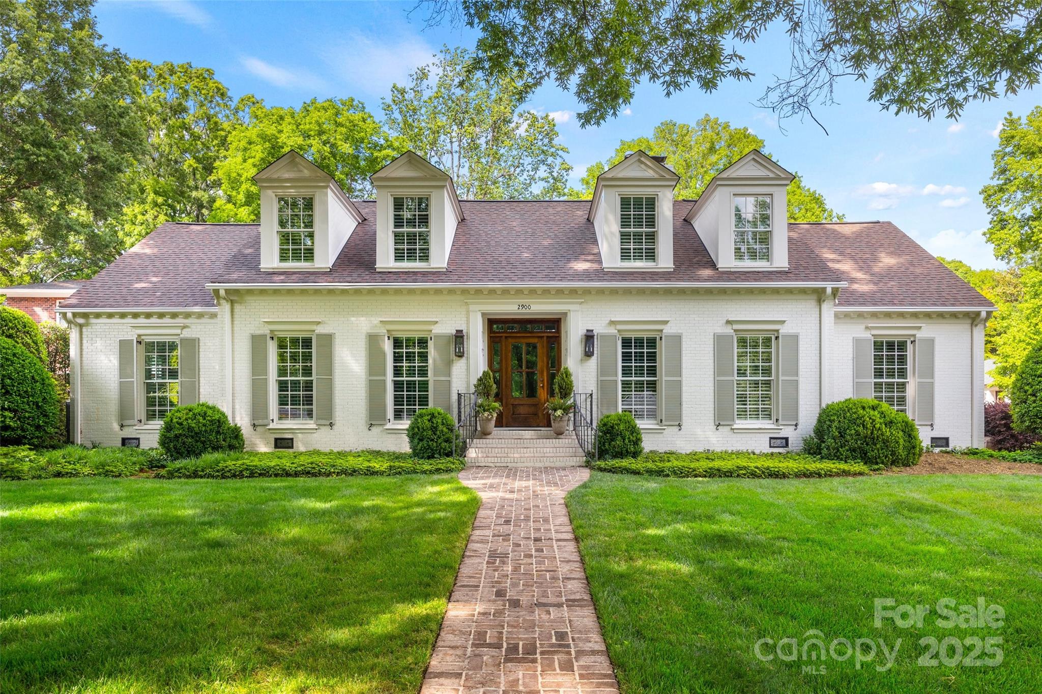 Welcome to 2900 Wickersham Road - charming traditional brick 1.5 story home nestled in the heart of sought-after Barclay Downs. This home offers spacious living areas, a thoughtfully designed floor plan, great nat light, classic architectural details, detailed molding, designer lighting & hardwd floors. Beautifully renovated in 2018. Spacious dining & living w/gas log fireplaces. Stunning kit w/lrg island, gas range/hood open to LR & bfast. Scullery w/2nd oven, bev fridge & ice maker. Main level features primary suite w/gorgeous bath, 2 secondary beds w/ensuite baths + office. Upper level includes loft, 2 add beds, beautiful full bath & oversized bonus rm. Covered side porch entrance w/dropzone w/locker cabinets, powder rm, laundry, wine cellar & door to oversized 2 car garage. Covered patio w/FP & heaters. Breathtaking pool & spa & professionally landscaped yard. Outdoor 1/2 bath. Amazing home situated on elevated & private corner lot surrounded by mature trees. Excellent location!