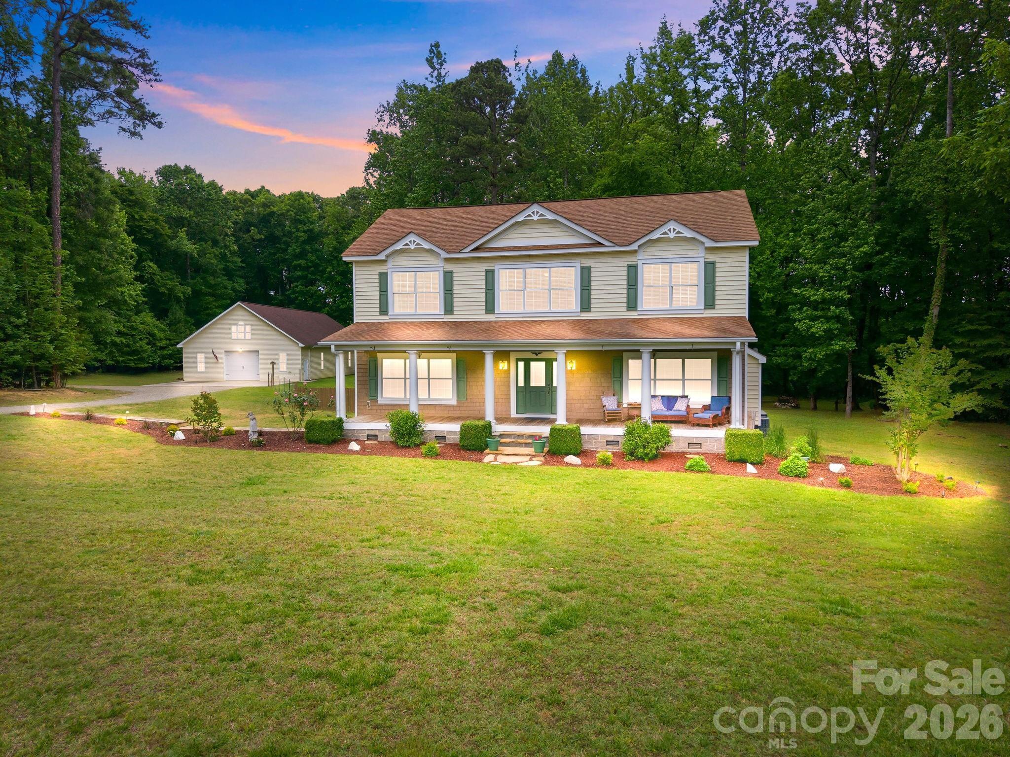 Nestled in the desirable Anchor Downs community just minutes from High Rock Lake, this beautiful 3-bedroom, 2.5-bath home sits on 7.63 private, wooded acres offering peace, space, and endless possibilities. Inside, you'll find gorgeous hardwood floors throughout, fresh paint, and a move-in ready interior with an open floor plan and spacious rooms. The kitchen boasts custom cabinets, tiled back splash, granite counter tops and stainless steel appliances including the refrigerator. The dining room is conveniently located off the kitchen and offers a serene view of the wooded backyard setting as you enjoy entertaining family and friends. This dining area flows to the covered and screened in back porch offering another option for outside dining and entertainment. The primary suite is located on the main level with a luxurious primary bathroom featuring tiled walk in shower and garden tub. All bedrooms include their own walk in closets.
A standout feature of this property is the extremely large garage and workshop, thoughtfully built to accommodate a wide variety of uses. Above the workshop, the expansive unfinished upper level provides a blank canvas with incredible potential for a second residence, guest quarters, office space, studio, or hobby area.
This unique property combines privacy, functionality, and versatility in a sought-after location near High Rock Lake.