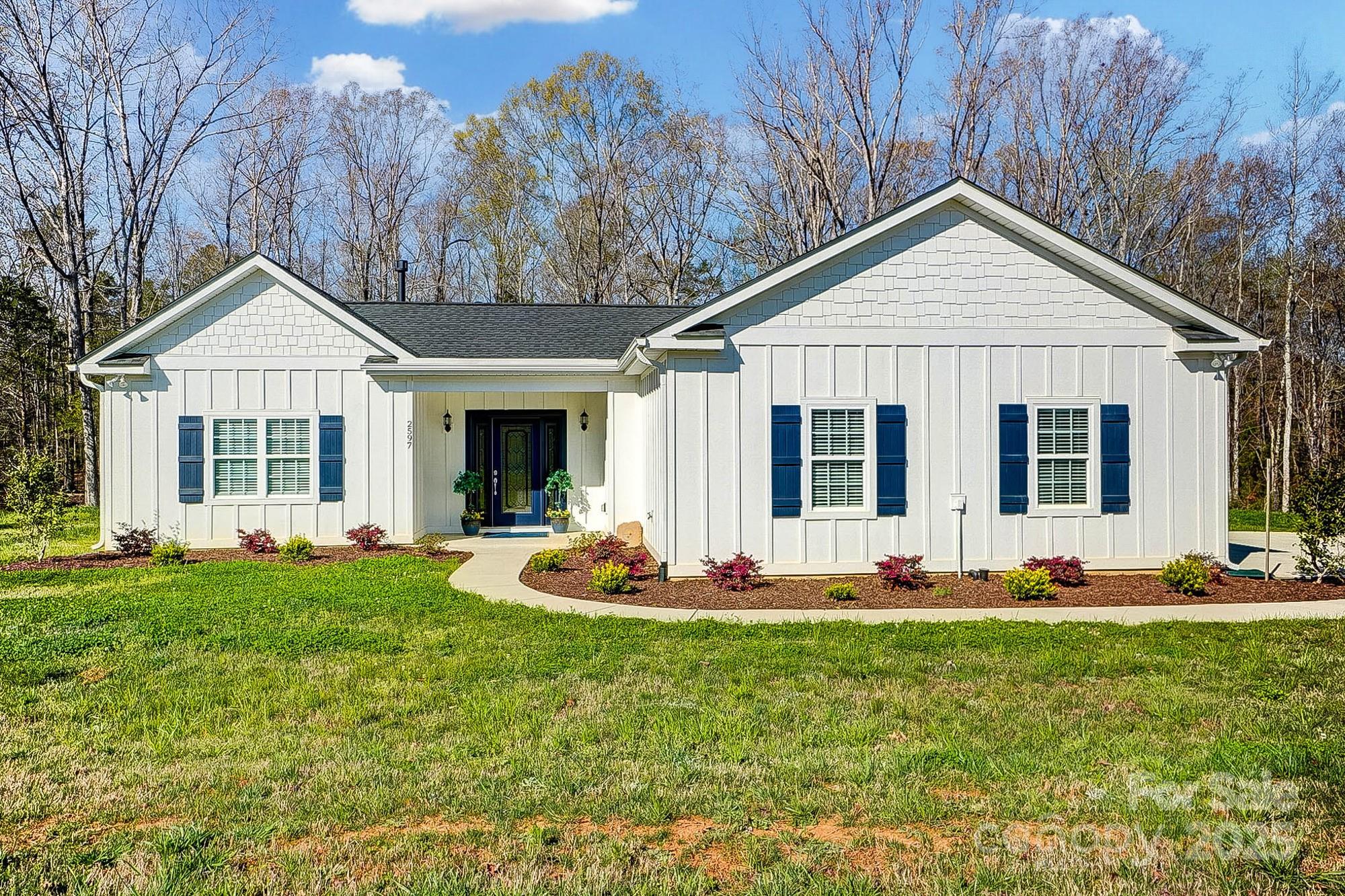 Better than new! Experience the perfect blend of modern luxury and peaceful surroundings in this better-than-new, custom-built home, completed in 2022. Located on the north side of Lancaster, this property sits on almost an acre, offering wooded views and plenty of space—ideal for a future pool or outdoor entertaining. A newly installed sprinkler system and upgraded well pump will help make lawn care a breeze! Designed with quality and style in mind, this home features upgraded finishes throughout, including quartz countertops, a large pantry, and a cozy fireplace in the open-concept living space. The screened porch is the perfect spot to relax while taking in the peaceful wooded backdrop. A spacious garage provides ample storage and convenience. Why wait for new construction when you can move right into this thoughtfully designed, custom home? Schedule your showing today!