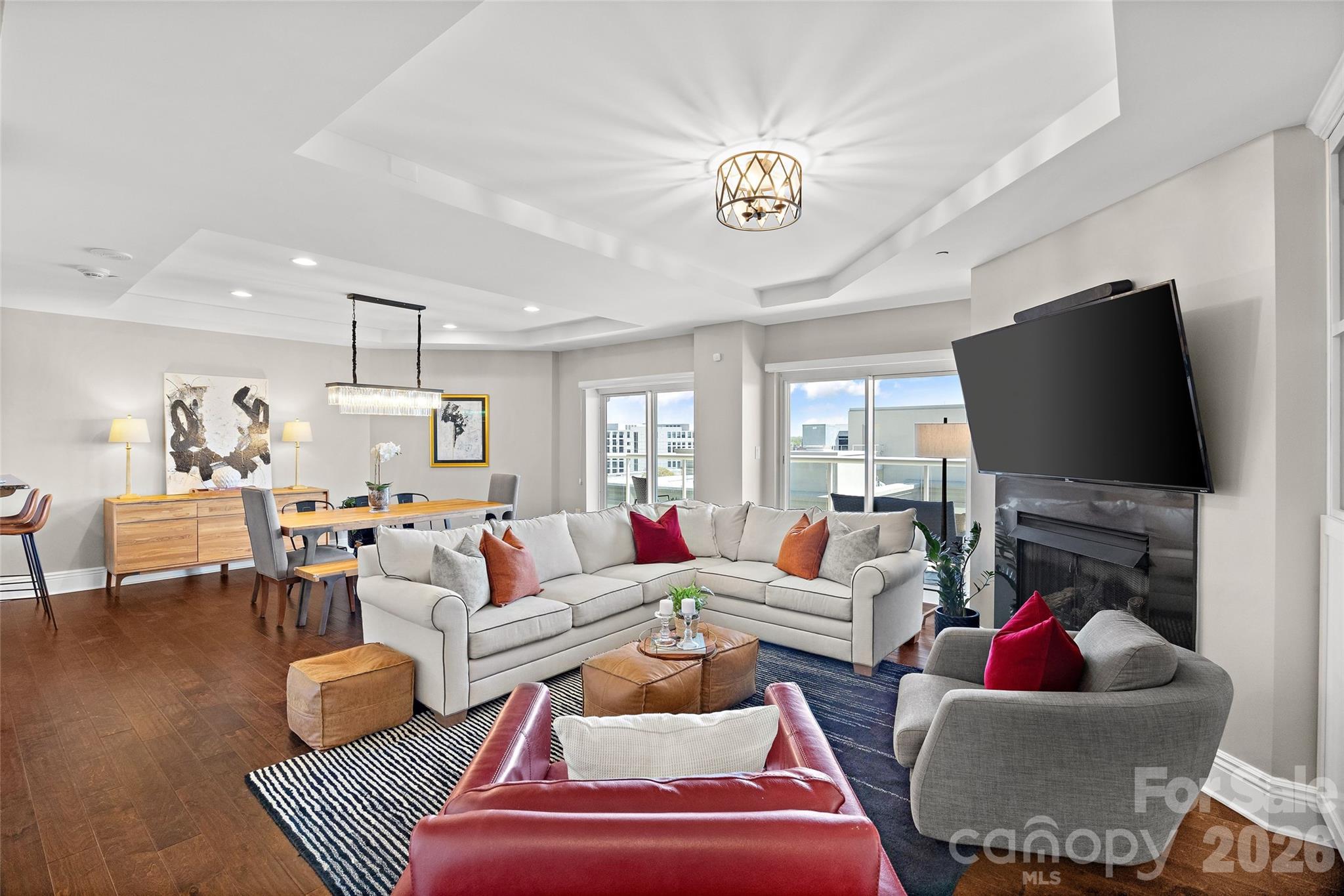 $15,000 Buyer Incentive Available + Rare Two-Story Junior Penthouse in Uptown Charlotte! Seller is offering $15,000 that may be used toward a mortgage rate buy-down, buyer closing costs, or prepaid HOA dues, providing flexibility to customize the benefit to fit your needs. Experience elevated city living in this rare two-story junior penthouse at The Madison, an exclusive boutique building with just 26 residences in the heart of Uptown Charlotte. Perched on the 11th floor, this unique home offers the convenience of condo living with the feel of a luxury townhome in the sky, complete with sweeping skyline views from a spacious covered terrace perfect for morning coffee, evening cocktails, or entertaining guests. The open concept main level seamlessly connects the kitchen, dining, and living areas, creating a bright and inviting space enhanced by hardwood floors, tray ceilings, custom built-ins, and oversized sliding glass doors. The kitchen features granite countertops, breakfast bar seating, a wine cooler, Bosch dishwasher, and updated fixtures. Upstairs, the spacious primary suite serves as a private retreat with a sitting area, oversized walk-in closet, and spa-inspired bath with soaking tub and glass enclosed shower. The secondary bedroom includes custom built-ins and desk space, making it ideal for guests, a home office, or both. An upper-level laundry room adds everyday convenience. With thousands of dollars in upgrades, two deeded parking spaces, and hotel style amenities through the HOA, this residence offers sophisticated, low maintenance living in one of Charlotte's most walkable locations. Enjoy easy access to Uptown's restaurants, sporting events, nightlife, entertainment, Whole Foods, and major employers, making it possible to leave the car at home and walk to work in the heart of the city.

Seller offering a $15,000 incentive flexible for a mortgage rate buy-down, closing costs, or prepaid HOA dues. Secure an effective starting interest rate as low as 4.875%