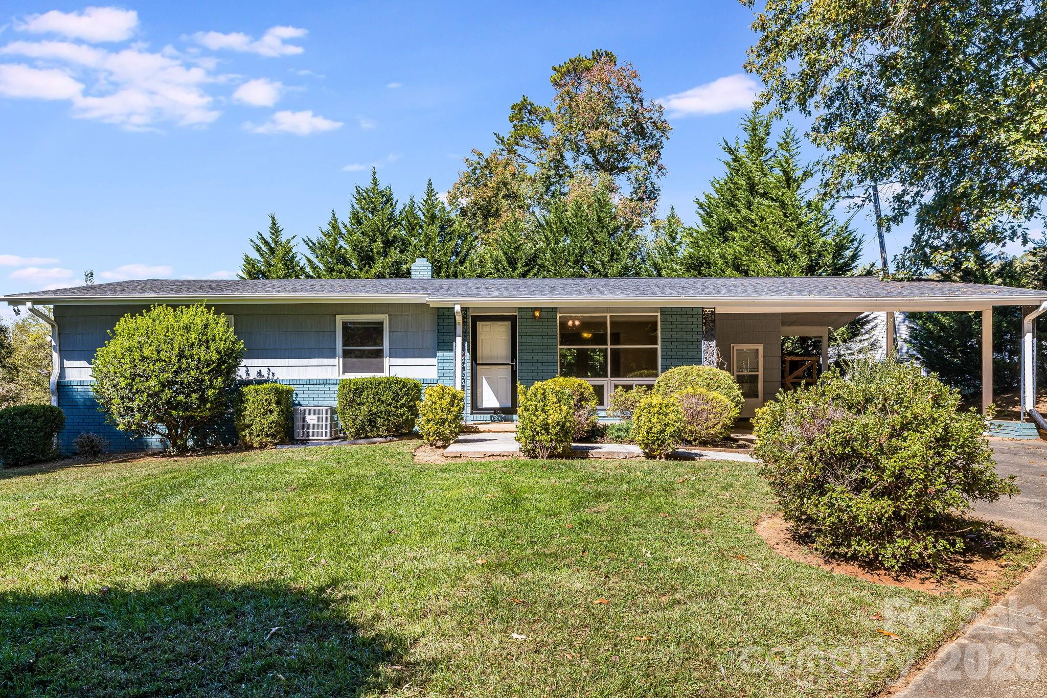 Imagine returning home in sought-after North Asheville. A private residence that offers both flexibility and a lifestyle that feels unmistakably Asheville. The property sits just a short walk from Beaver Lake, where locals begin their mornings on shaded trails or linger at the bird sanctuary on quiet afternoons. Mid-century Asheville living with simple lines, a low
roofline and a friendly facade feel warm as you approach the home's front door. Anchored by a wide picture window,
shaded entry and covered parking that tie the home's practical easy living character together. Soft blue with crisp white accents, this home is a marriage of vintage design and fresh quality. This versatile property gives you options. Live on the main level and rent the lower unit for steady income, rent out both levels as a duplex or plan for the future by converting it back into a single-family home. Each level has its own entry and serene sense of privacy, making it well suited for
multigenerational living or long-term tenants. An additional lot next door is also available. Keep it with the home for added space and privacy, subdivide and build, or purchase the home alone. The layout and setting make each choice feel natural in support of your goals. With mature trees, a large, lush, usable yard as home base, and close proximity to shopping, dining, and downtown Asheville, you're going to appreciate the mix of calm and convenience that defines what generations have loved about North Asheville living. This property is being offered with additional lot (PIN 973086152900000) at a price of $660,000 or without the additional lot at $550,000.