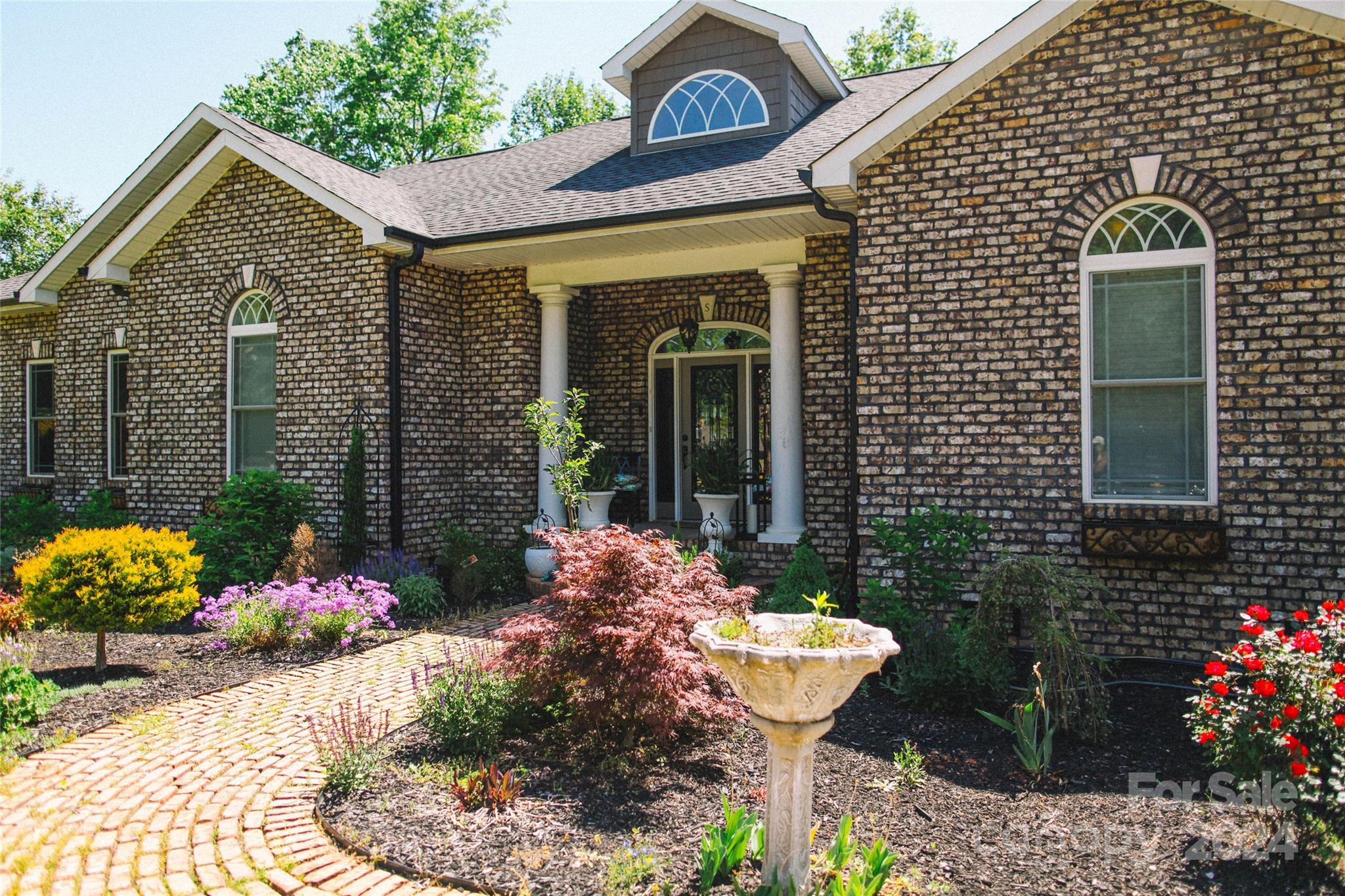 Welcome to this custom built oasis of a property. This 3 bedroom 2.5 bath brick one level stunner is the property you have to see in person. Nestled on a lovely street with manicured front yard, this unique property boast 3.14 acres with natural wooded views and a creek. 

Enjoy the primary suite with walk-in closet and private living space as well as en-suite with garden tub, private toilet, double sink vanity, and multi-head walk-in shower with built-in seating.

The large three car garage is divided into one two spot garage as well as a separate third space section that can be used for parking or a variety of personal uses/storage/workshop. New AC unit installed 2023.

Take in the wooded private views from the many windows throughout the home or on the covered balcony off the open kitchen/living/breakfast area with ceiling fan. 

Located conveniently near major road ways, state lines, crowders mountain state park, and within 30 miles of US national white water center.