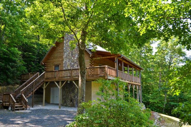 SPECTACULAR VIEWS...Own your own slice of Blue Ridge Mountain Heaven!  This Southland Log Home built in 2002 is your perfect dream getaway...very quiet, peaceful and private, located within minutes of Linville Falls Golf and Country Club, Linville Falls, Grandfather Mountain, The Blue Ridge Parkway, Boone, various ski slopes and other Blue Ridge Mountain attractions.  Enjoy views of the Blue Ridge Parkway from the large front porch and almost any room in the cabin.  Three bedrooms (loft area being used as a bedroom), two baths, large open great room with stone fireplace (currently with gas logs, but can burn wood), laundry room, workshop area in basement...nothing left undone! A must see!
