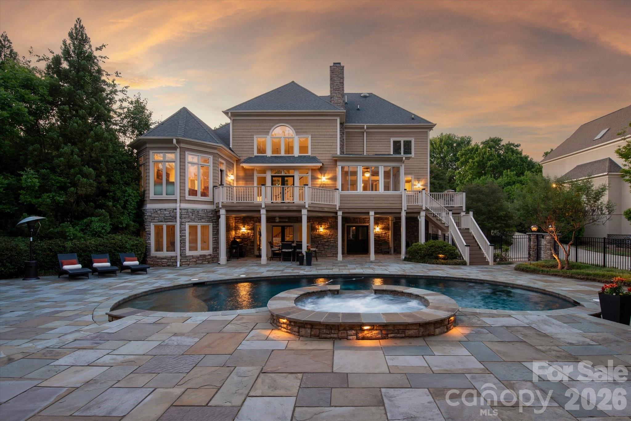 Welcome to 12509 Pine Valley Club Dr, a truly resort-style home in beautiful Providence Country Club. This home has the outdoor oasis you've been searching for!! And with 4,590 square feet of thoughtfully designed living space, this expansive 5-bedroom, 5-bathroom property offers both style and functionality for comfortable living and entertaining.

Step inside to find a bright and open living area featuring a charming fireplace as well as a designated office and formal dining space. Kitchen comes complete with a gas stove, double oven, dishwasher, breakfast bar, and ample storage. Sun porch directly off kitchen could easily be converted into a bright breakfast room overlooking the pool! Primary bedroom on main floor with updated bathroom and custom walk-in closet make for a perfect retreat along with 3 additional generous sized bedrooms upstairs.

The fully finished basement provides additional living or recreational space to suit your needs, with a main living area, game area, wine cellar, and additional space to truly spread out! Outside, your personal oasis awaits with a stunning below-ground pool, hot tub, and a pool house. Pool house comes complete with heated bathroom and outdoor shower, as well as a bar with a dishwasher and space for an ice machine. You'll certainly be spending many days and nights luxuriating in your own private resort! Home is close to I-485, shops, and restaurants.

Neighborhood amenities can be used in conjunction with a Providence Country Club membership but membership is not required to live in the neighborhood.

Don't miss the chance to make this exquisite property your next home.