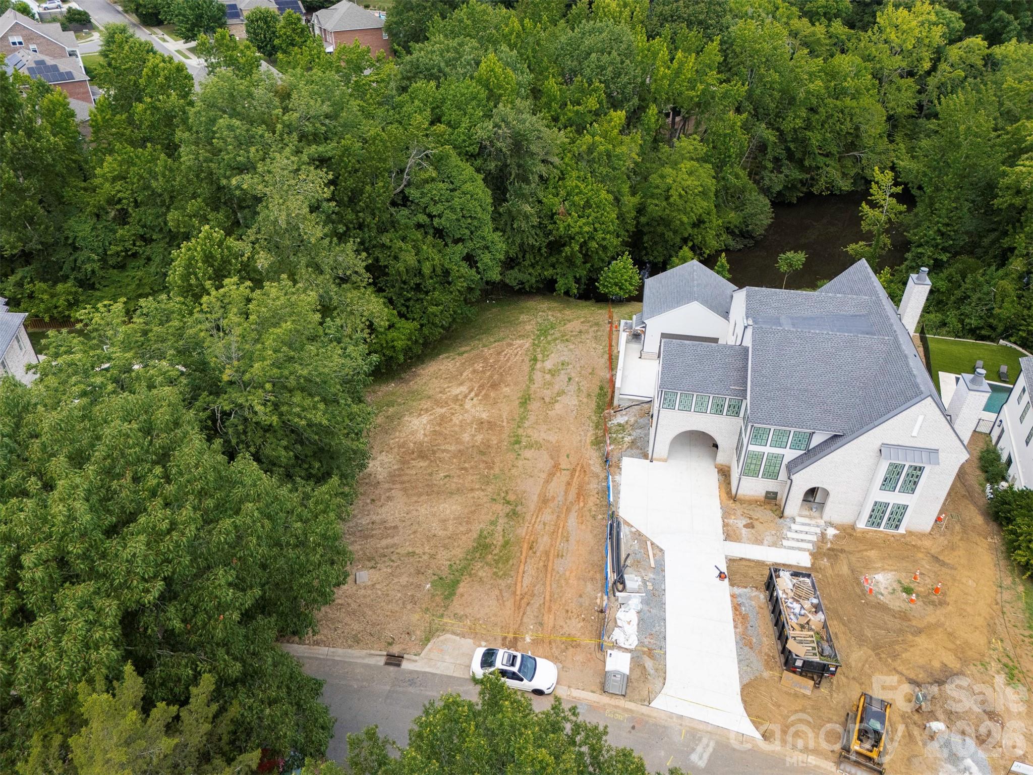 Fantastic opportunity to build your dream home on a cleared .673 acre lot by the end of the cul-de-sac in Sharon Hills near the Quail Hollow golf course. Deep lot is ideal for a basement home overlooking trees and a small private pond.