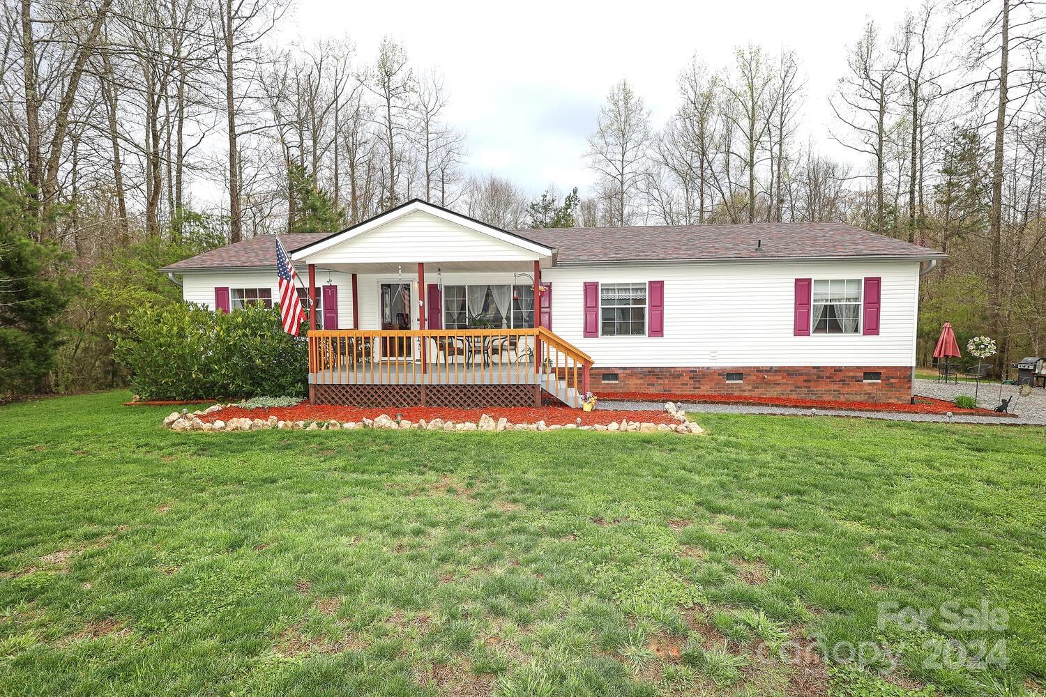 NO HOA!  Welcome to your private oasis; well maintained 1602 square foot ranch on 2 acres. Home boasts a large back deck overlooking beautiful blue pool. Open floorplan, spacious living room, dining room and kitchen plus a large family room w/wood burning fireplace.  Kitchen has a big island w/plenty of cabinet storage space. Separate pantry/laundry room. Split bedroom floorplan has a generous primary suite w/En Suite and walk-in closet. It has a brand new roof (2023); water heater (2021) Dishwasher and microwave (2020) HVAC (2018) stove/refrigerator (2017); well pump (2016); all new wood/flooring on deck and porch (2016) and gutters w/gutter guard added (2015).  Home is well landscaped & flowerbeds, 2 garden areas & beautiful trees including a willow & peach tree.  It comes w/two sheds (one wired) for outdoor storage needs. Check out this hidden gem!  (3rd bedroom being used for packing) See tour:https://catch-light-studio.seehouseat.com/2229037?idx=1 (Foundation Certification in MLS)