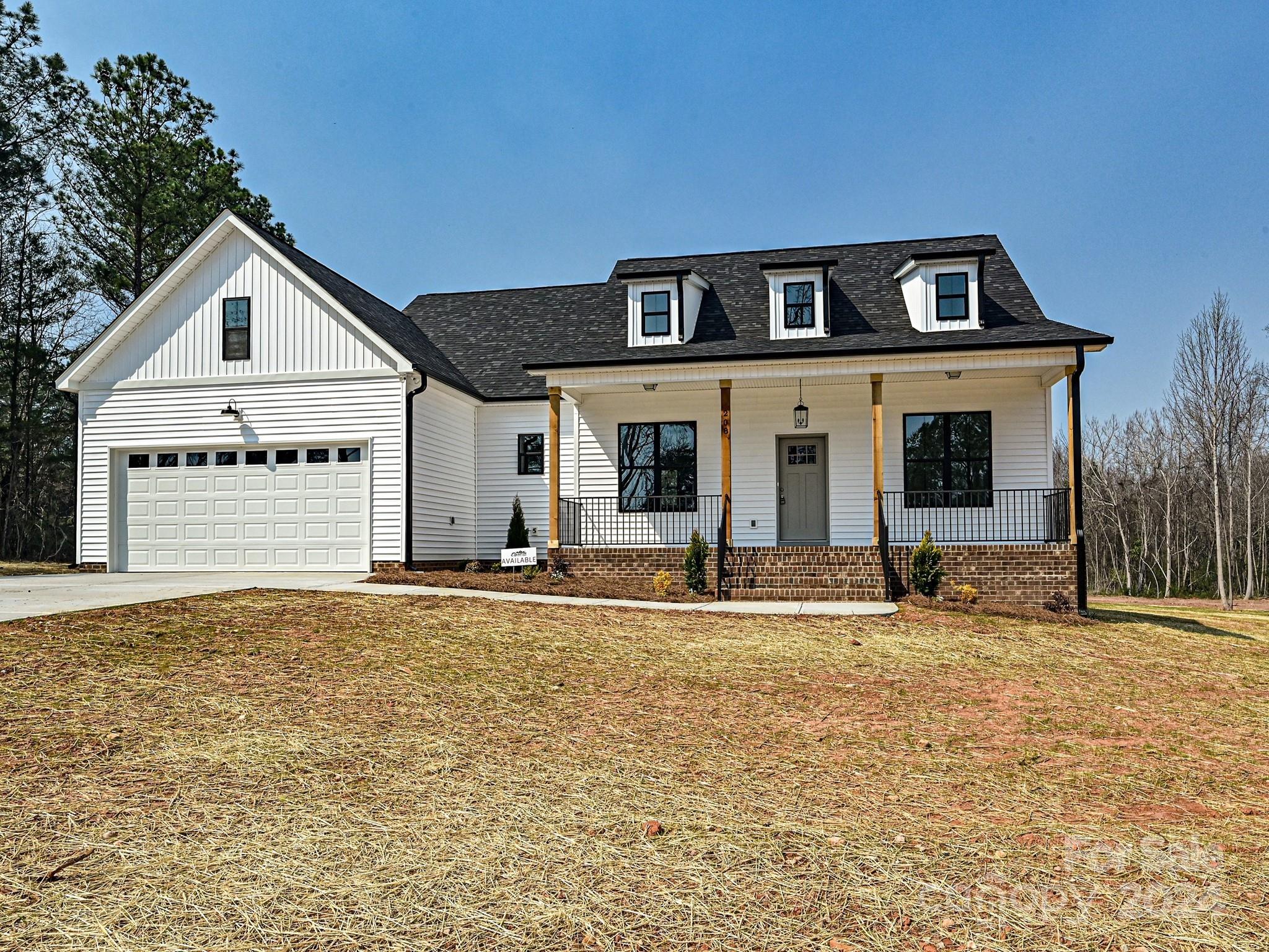 Brand new 3 bed/2 bath home w/ a rocking chair front porch built near York's charming Downtown area! This home is a part of a small 5 home subdivision with NO HOA!! This plan features so many upgrades: Open floor plan,  gigantic walk-in Primary closet *with direct access to laundry room*, tiled shower w/ glass door & a freestanding tub in primary bathroom, no carpet anywhere, vaulted ceilings in the Great Room, and soaring 10ft ceilings everywhere else. Kitchen comes equip with an island, upgraded/taller upper cabinetry, granite countertops, and an extra, extra large walk-in pantry!! Both the front and back porches have poured concrete floors & are covered! Home is currently under construction and the estimated completion date is approximately April 2024. Schedule your private showing today--There's nothing like these on the York market. Snag yours early in the build process and add-on some customizations/choose your colors.