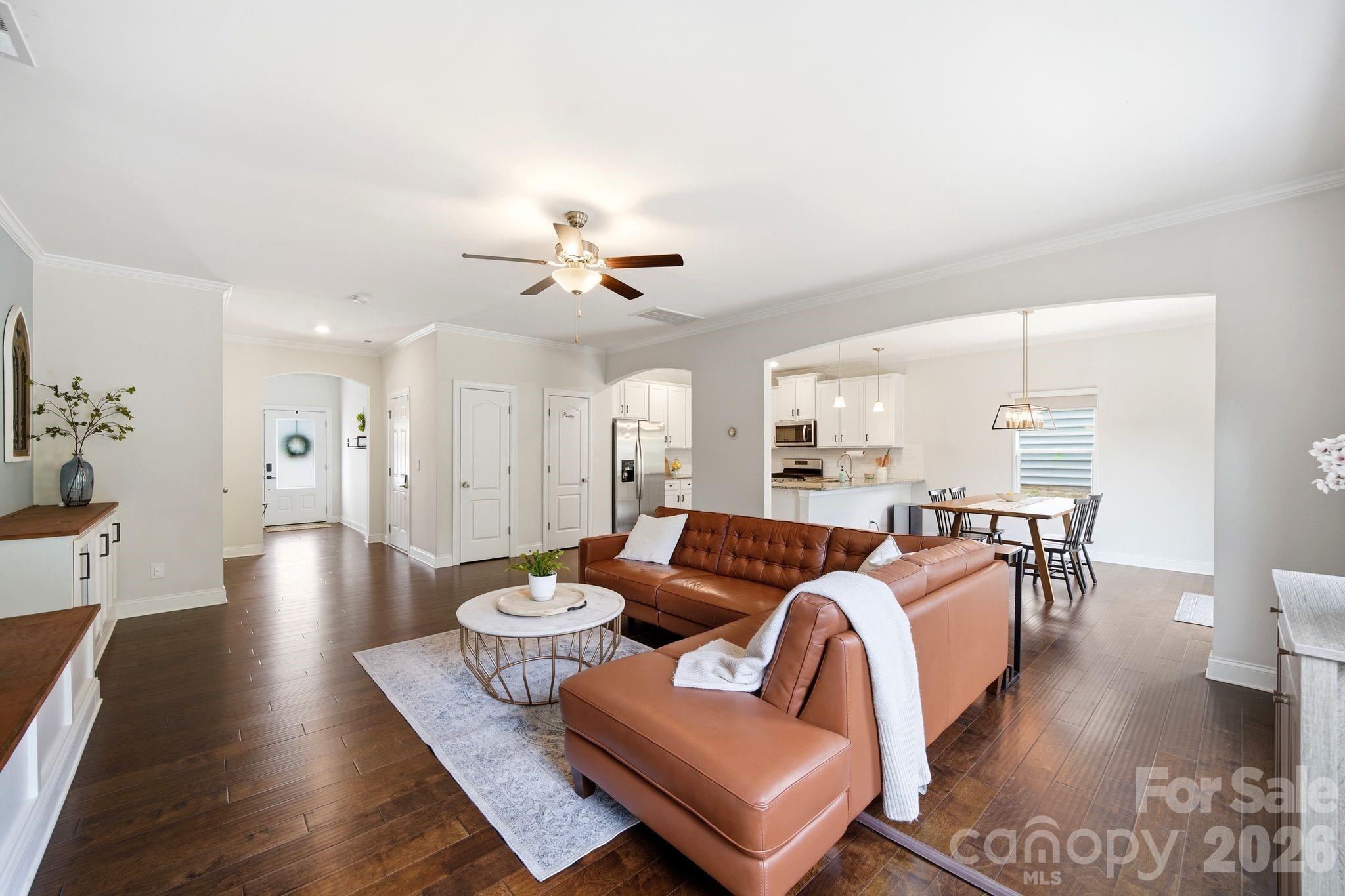 Welcome to 621 Cape Fear Street! Combine high-tech efficiency and high-end comfort. If you’ve been looking for a property that balances modern sustainability with a warm, "homey" feel, this is IT.
One of the most significant features of this home is the fully integrated energy savings. A paid and transferable Pure Black Solar panels with Enphase microinverters. The garage is finished—epoxy floors and all—and comes fully wired for your electric vehicle charger, making the home future-ready.
Inside, the home has been thoughtfully reimagined with upgrades that matter. The main living area is framed by custom cabinetry and features motorized blackout blinds in the living room, dining room, and master suite—perfect for creating the right ambiance at the touch of a button. The entire house is "smart-wired" with integrated lighting switches, and a whole-home water filtration system ensures quality from every tap.
The second level is just as impressive, with engineered hardwood floors flowing through the halls and updated tile in the bathrooms and laundry room. The master suite has been transformed into a true sanctuary, featuring a remodeled bathroom complete with heated floors—a luxury you’ll appreciate every morning. From the updated light fixtures to the refreshed powder room, every corner of this home feels intentional and upscale.
Outside of the four walls, you’re in the heart of Fort Mill’s vibrant community, where you get the benefit of a modern, efficient lifestyle without sacrificing the charm and space this neighborhood is known for. The property footprint extends about 30 feet past the current rear fence line, offering an incredible 'deck-ready' landscape. Follow the lead of neighboring homes and add a custom tier-down terrace deck to unlock an elevated, panoramic view of the lush tree canopy behind you—creating the ultimate private outdoor retreat. 
Welcome home to 621 Cape Fear.