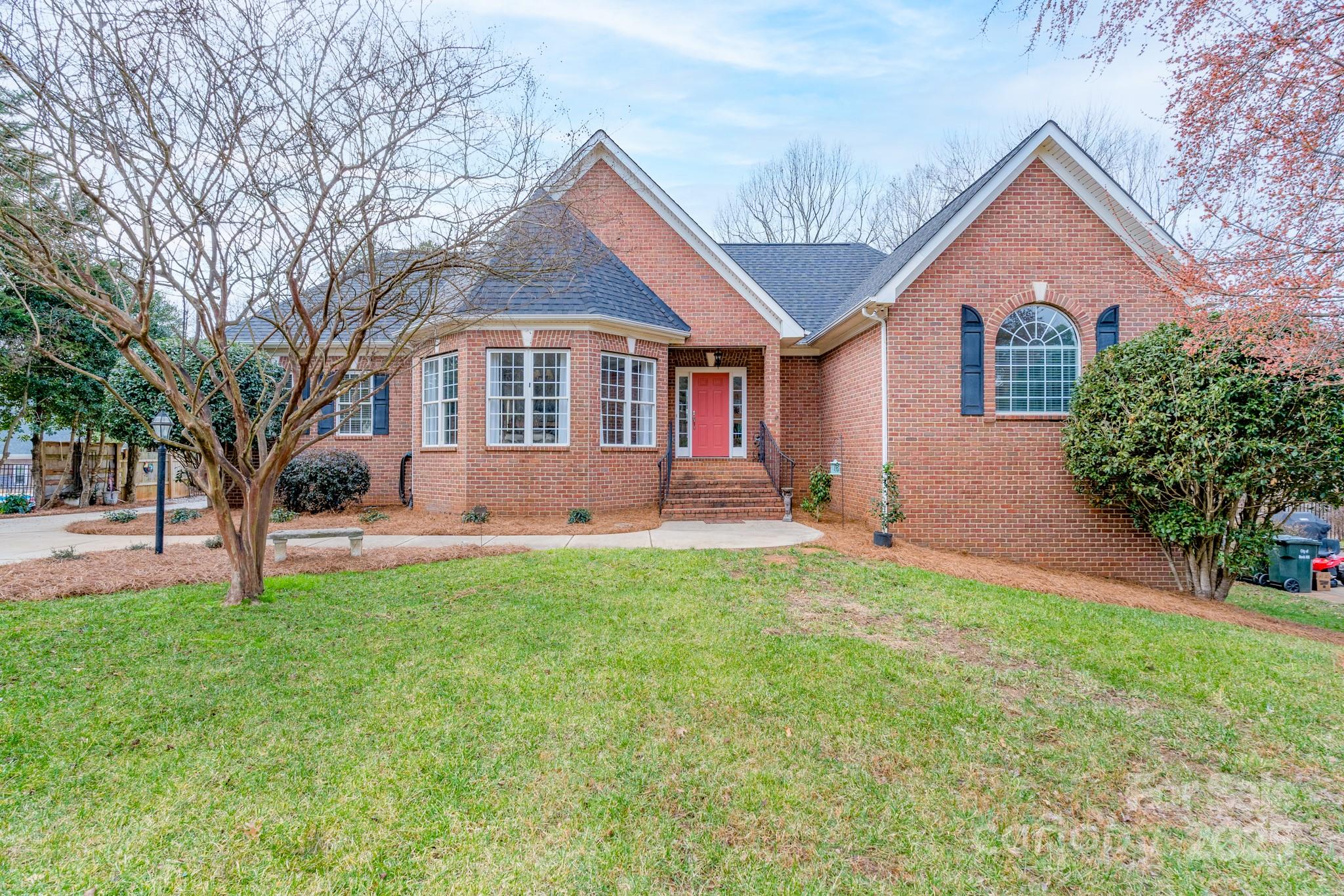 This custom all-brick home is a rare find! The main floor features beautiful hardwood floors, a chef's kitchen (with double ovens, island, butler's pantry, and breakfast area), family room with fireplace, grand dining room, expansive primary suite, and office/library with custom built-ins. A whole new world awaits in the finished basement area with three graciously sized bedrooms, two bathrooms, a rec room/den with fireplace, flex space, and laundry room.  The potential in this home is unlimited! Outdoor living takes on new meaning with the screened-in porch and deck on the main level and a covered porch on the lower level. The oversized two-car garage provides fabulous space for your vehicles and additional storage.  As an added bonus, there is a storage room with an exterior entrance on the basement level and a new roof has been installed in 2025. New gutters will be installed before closing. You do not want to miss the opportunity to check out the character and charm of this home.