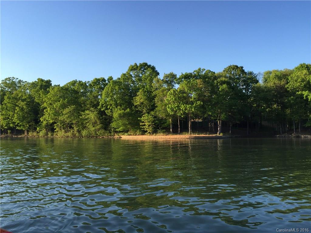 Mostly cleared, Deep Waterfront lot in Gated Lake Norman Community. Bring you own builder! Gentle sloping basement lot with Keystone Block Shoreline Retaining Wall. Perc test is for 4 bedrooms. Pier/Dock is allowed.