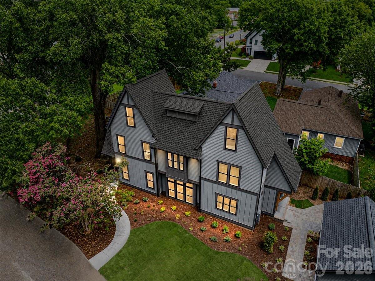 Stunning architect-designed new construction just minutes from NoDa and Plaza Midwood! With incredible attention to detail, 3940 Admiral Ave offers easy flow through the main living spaces and intentional window placement that brings in abundant natural light. The open kitchen features quartz counters, a large island, ceiling-height cabinetry, and GE Café appliances, including a gas range with vented hood. Natural white oak hardwood floors, custom built-ins, and thoughtful closet placement add warmth, character, and generous storage throughout. The spacious primary suite offers a private retreat with a walk-in closet, freestanding tub, large shower, dual vanity, and separate water closet. The secondary bedroom on the second level includes its own private bath. The third floor includes a bedroom with a full bath, along with a flex space that can function as a guest bedroom (no closet), office, playroom, or media room. A Rinnai natural gas tankless water heater delivers efficient, on-demand hot water. A private paver patio extends the living space outdoors for low-maintenance entertaining, and a detached one-car garage adds both convenience and separation from the main home. Centrally located near the light rail, neighborhood staples, and some of Charlotte's most popular dining and coffee spots. Home is eligible for up to $12,000 in down payment and closing cost assistance with use of preferred lender (restrictions apply). A rare opportunity to own a design-forward single-family home at this price point in 28205!