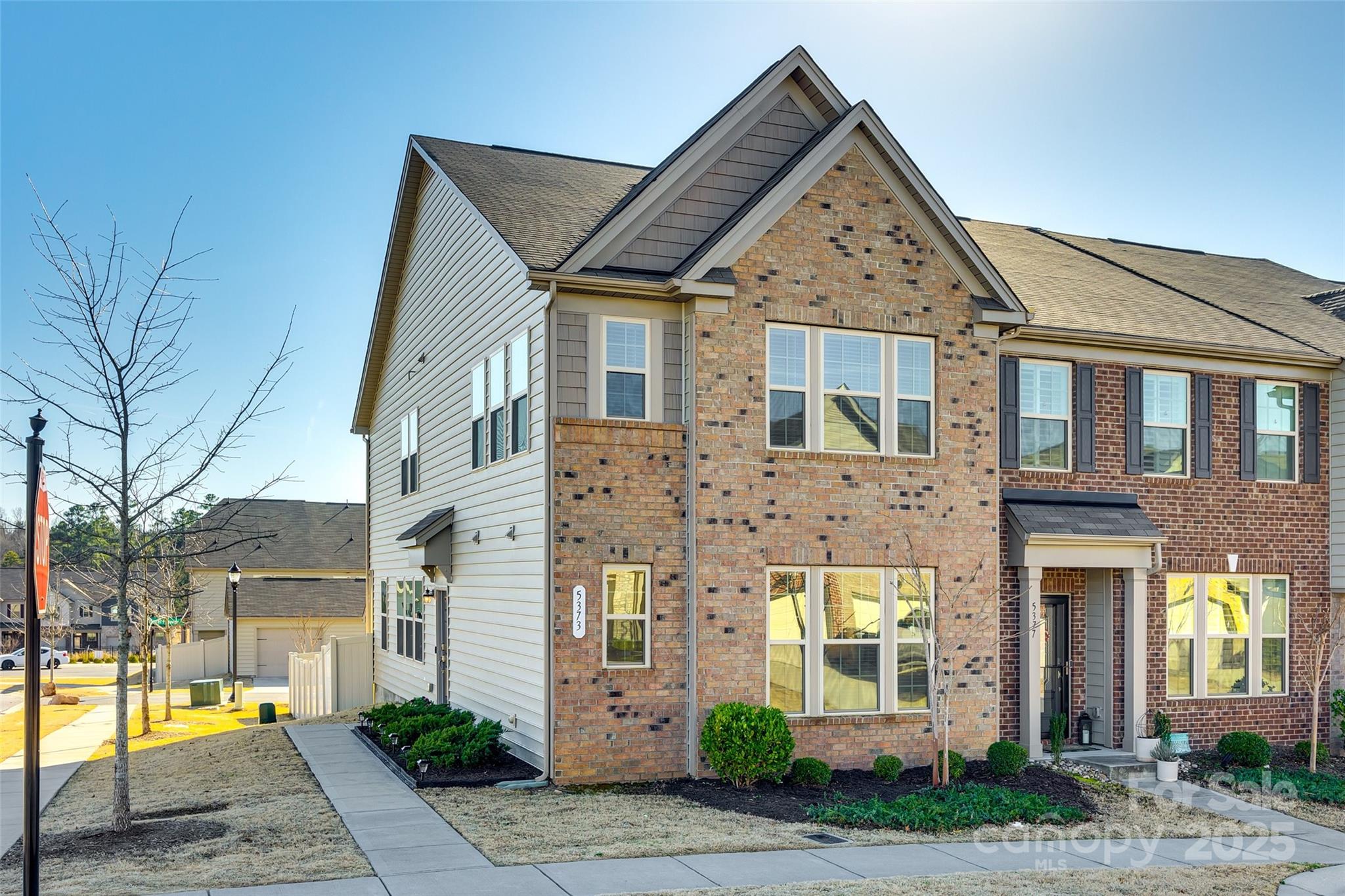 Welcome home to this stunning end unit townhome in the popular community, The Greens.
Situated on a prime corner lot with easy access to walk to the community pool, this open floorplan is a true showstopper. As you enter from the charming side porch, you will immediately notice the gleaming natural light from all the bright windows, LVP flooring, & freshly painted pure white walls.  Enjoy cooking and entertaining in the sparkling white kitchen with quartz countertops, gas range, pendant lights & walk in pantry. Ideal layout with a cozy great room area that is open to the kitchen & dining room. The first floor also features the primary suite with walk in closet, & a separate tub 
& shower.  Upstairs has a spacious loft area with so many options to make it your own.  2 additional guest bedrooms are down the hall & share the dual vanity guest bathroom.  Don't miss the fenced in back yard and 1 car garage.  Move right in and enjoy townhome living - property comes with refrigerator, W & D