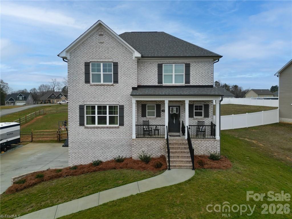 Practically new home! Gorgeous two story home on corner lot with lower northern Davidson County taxes! Covered front porch perfect for sipping sweet tea in a rocking chair. LVP throughout main level with open kitchen and living area concept. Gas fireplace and loads of natural light. Granite counters, large island, pantry, and SS appliances plus a butcher's pantry. Coffered ceilings in the formal dining gives elegant touch to your holiday meals. Spacious primary suite with large WIC, dual vanity, and walk in shower. Find two additional rooms with walk in closets and spare bath. Finished basement bonus room ideal for home office, playroom, or bonus room. Two car garage with extra space for storage. Step onto back deck to grill and entertain while four legged furry friends can roam the fenced in backyard. Storage shed for yard tools and more. NO HOA! Easy access to Lexington, Winston Salem, and of course, the heart of Welcome!