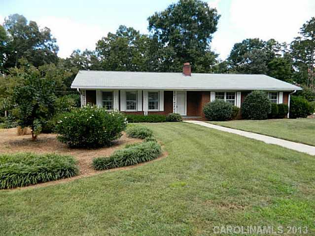 MOTIVATED SELLER!  Quality built home!  Beautifully refinished Hardwood Floors shine like glass!  Three bedrooms, 2 baths, living room, dining room combination, eat in kitchen, nice den, full basement with fireplace has  heat & air but unfinished just waiting for you to make it whatever room you want it to be.   Nice patio overlooking lush landscaping.  Basement garage.  Convenient to everything.