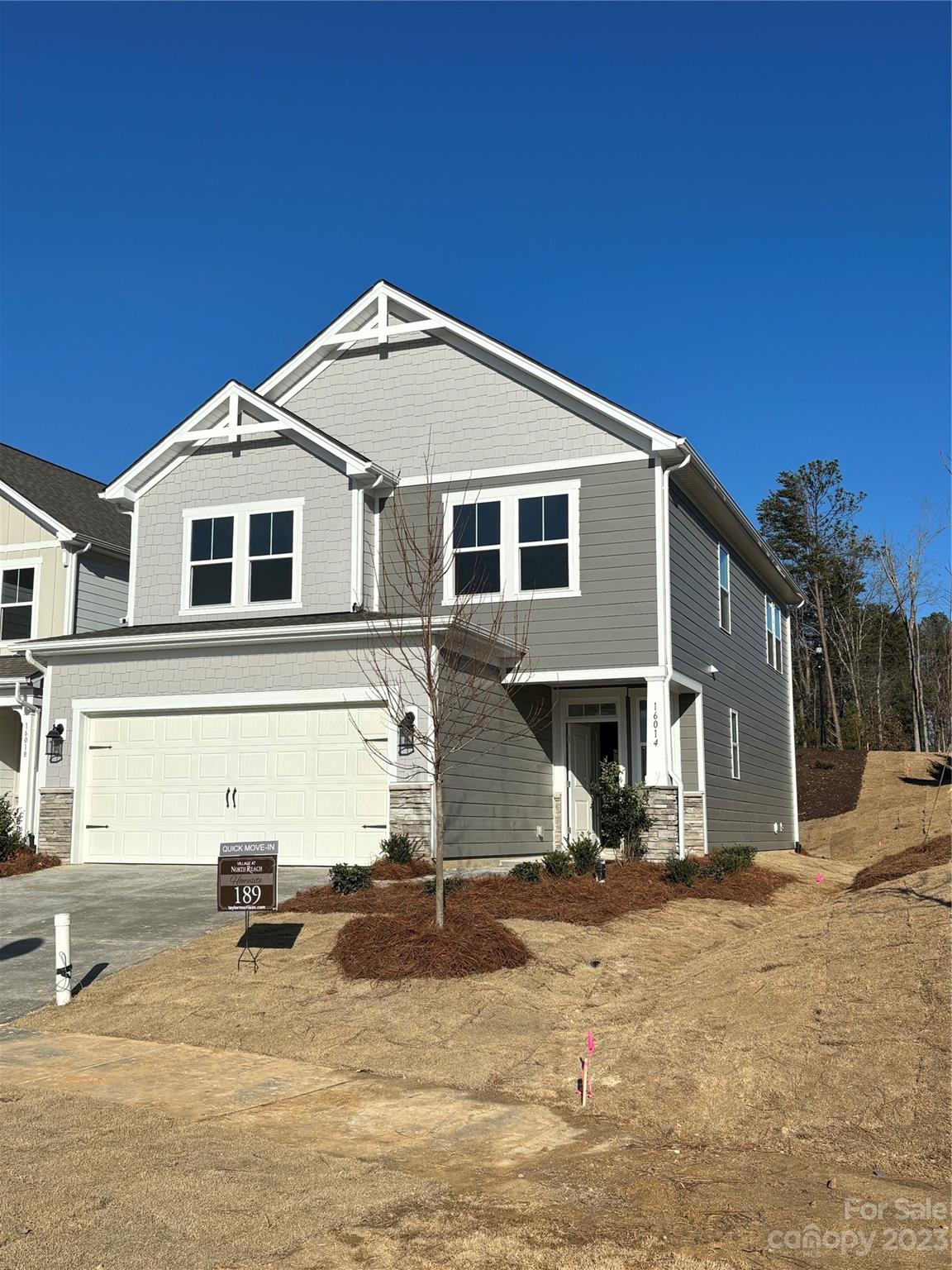 MLS # 4071693 Winter 2023/2024 Completion! The Manteo is a 2-story home that includes a spacious great room, luxurious second-story owner's suite, a loft and two additional bedrooms. Enter through the foyer and walk past the half bath and staircase to reach the open-concept great room and kitchen area. Inviting covered outdoor living space is just past the casual dining area, providing additional entertaining potential. Upstairs you will find the owner's suite, two secondary bedrooms with a full bath, a laundry room, and a loft with tech area, perfect for a work from home space. Structural options include: covered outdoor living, drop zone and utility sink in garage.